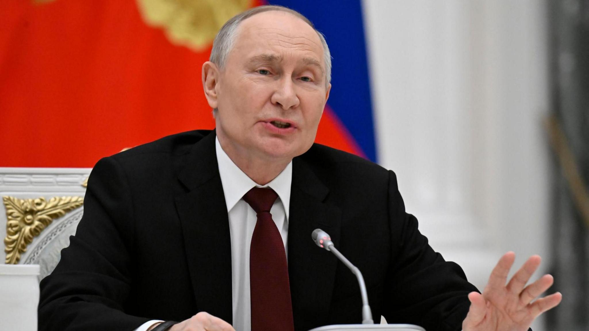 Russian President Vladimir Putin speaks at a press conference. 