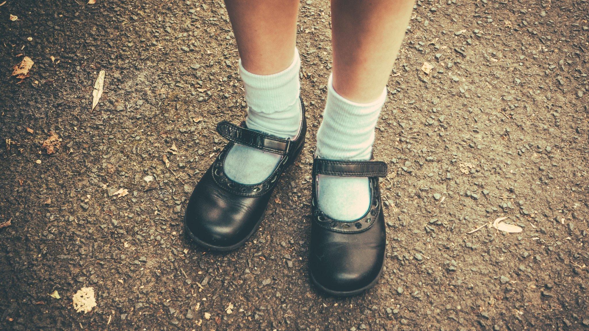 A picture of a girl in her school shoes