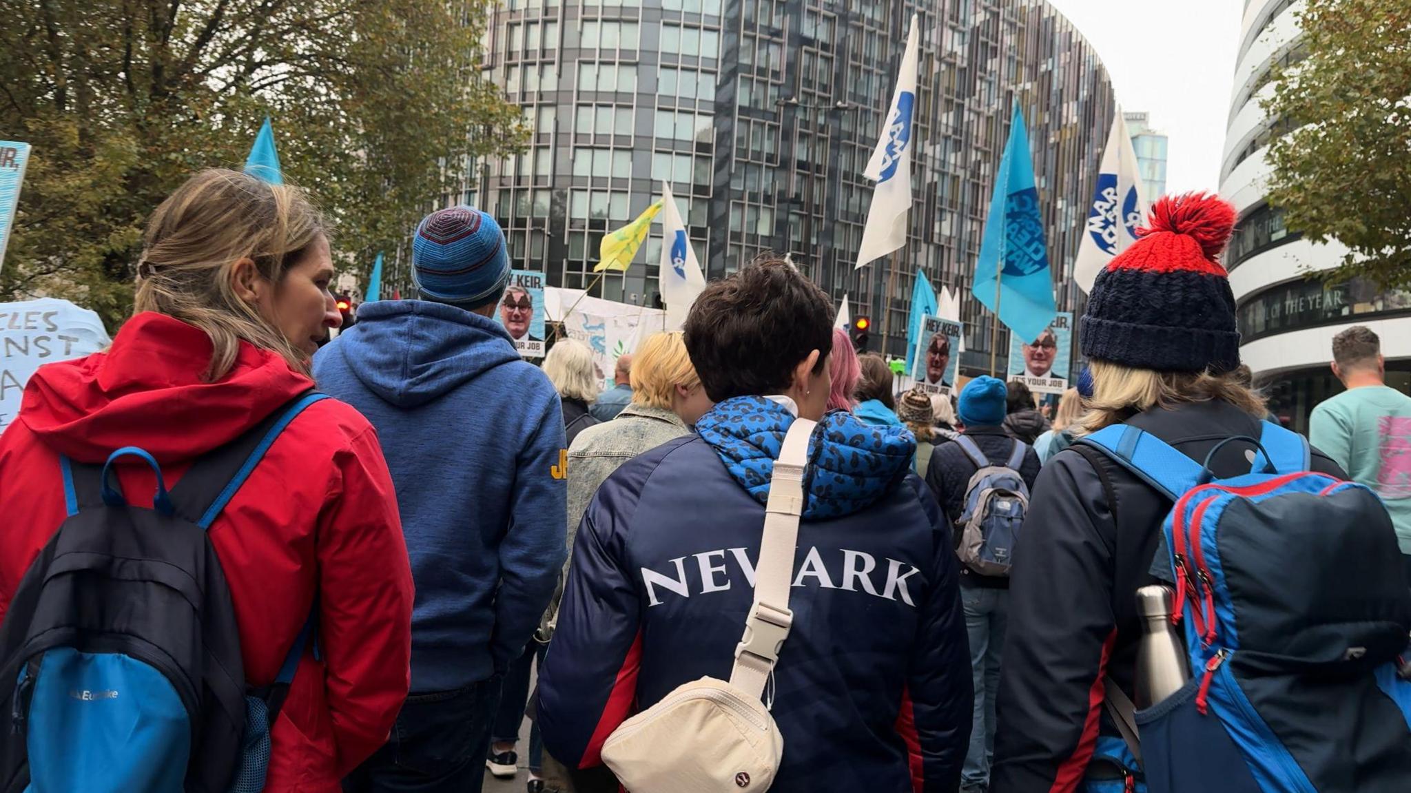 Protesters march through London waving flags and banners