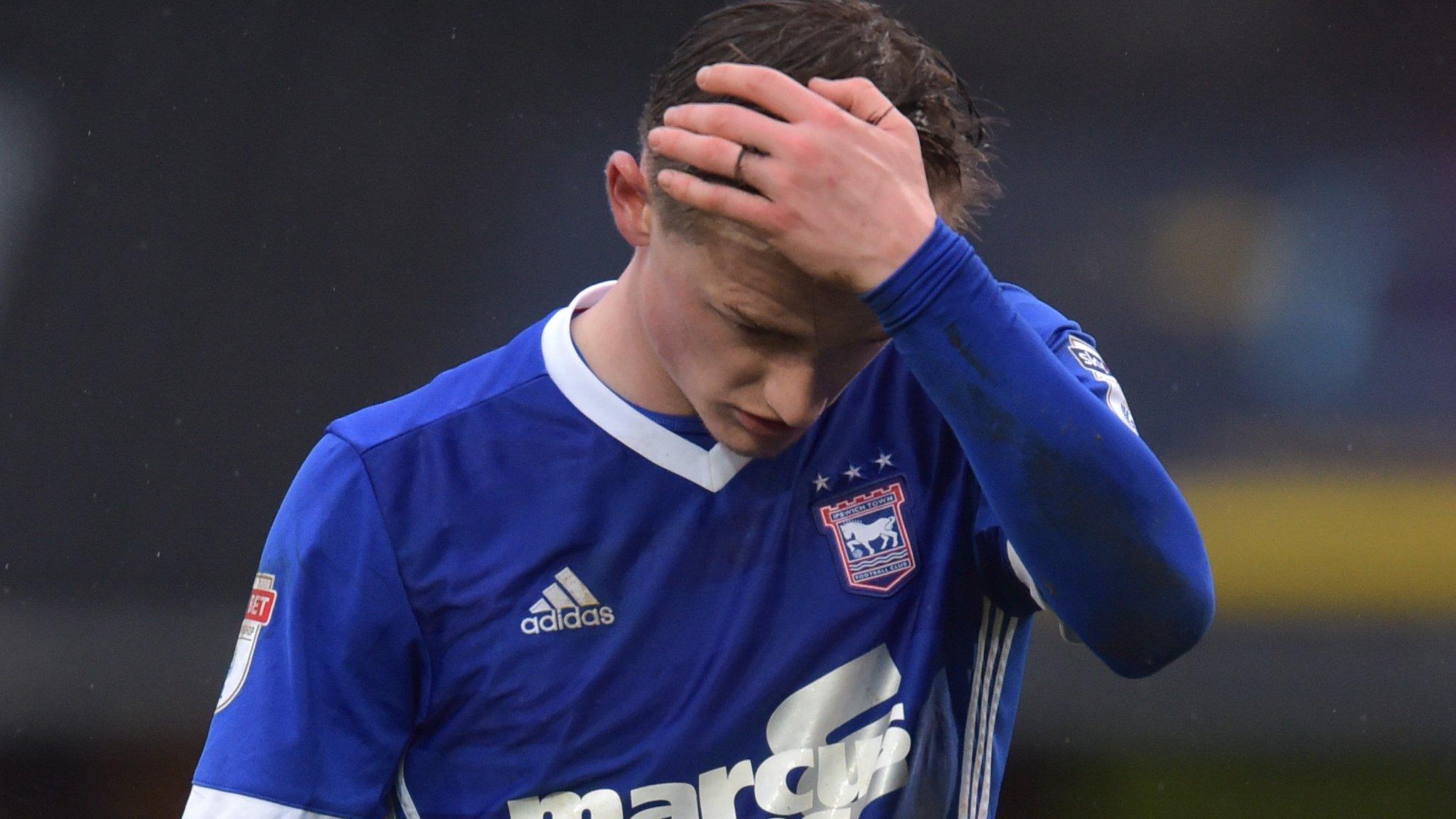 Ipswich's Callum Connolly holds his head