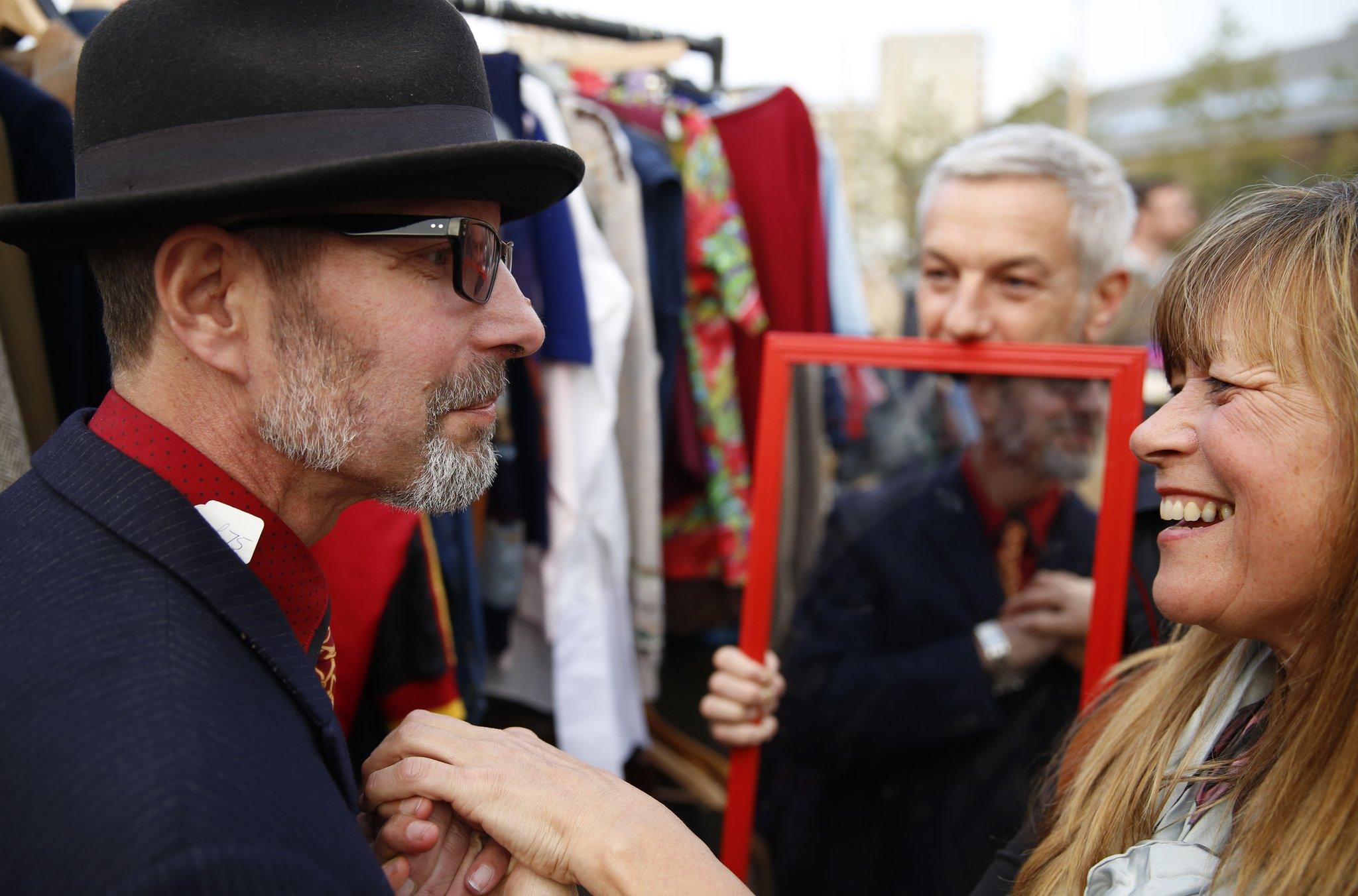 Graham Pawley tried on a jacket at a vintage clothes market stall