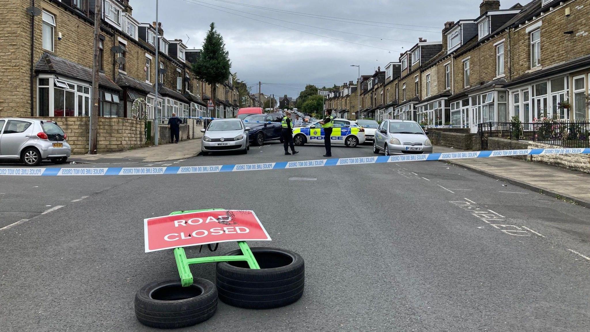 Police tape across Fairbank Road in Girlington, Bradford