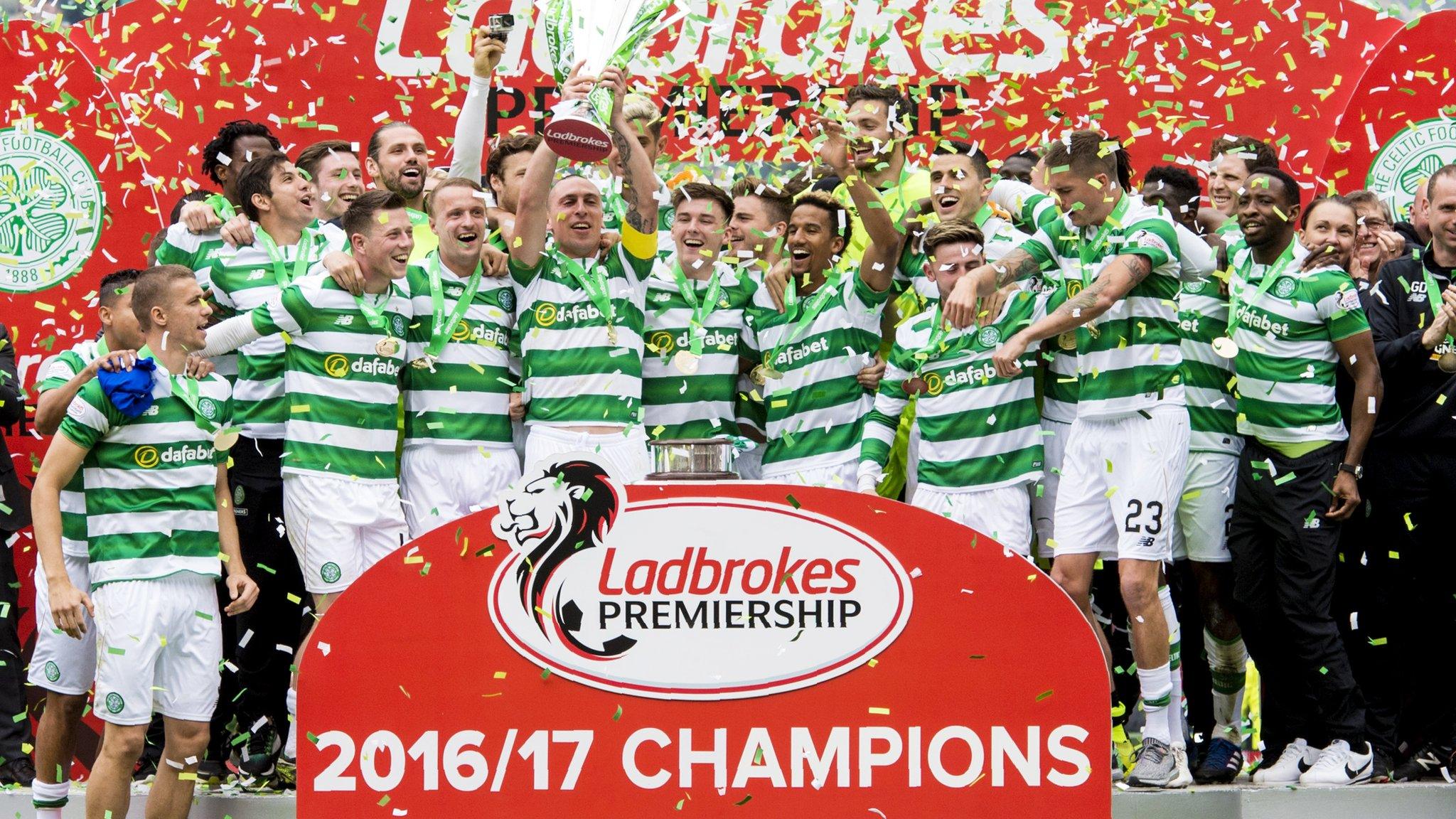 Celtic players celebrate winning their sixth straight league title