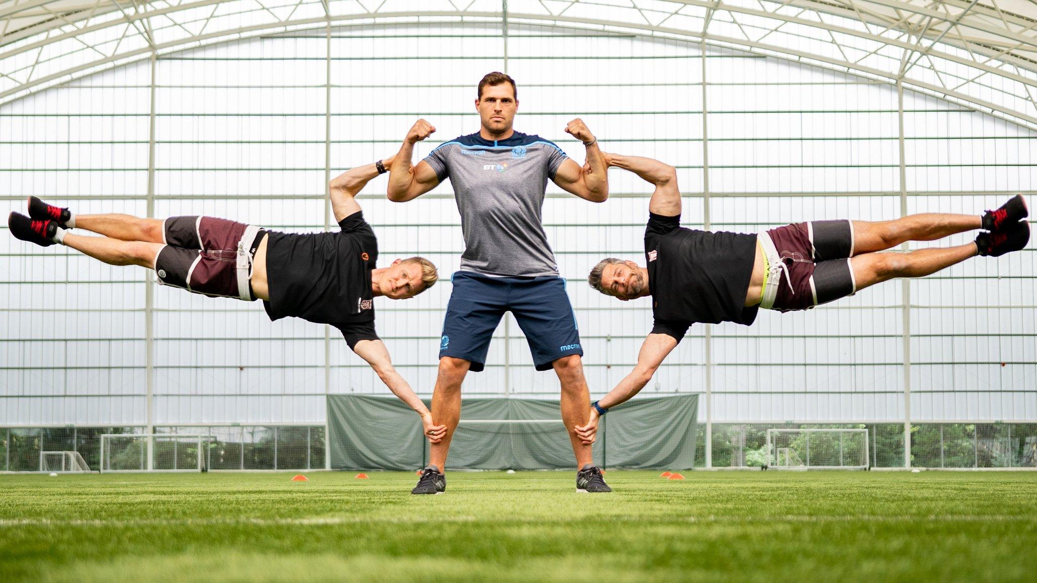 Sean Lamont, David Jackson and Tim Stevenson performing a human flag exercise