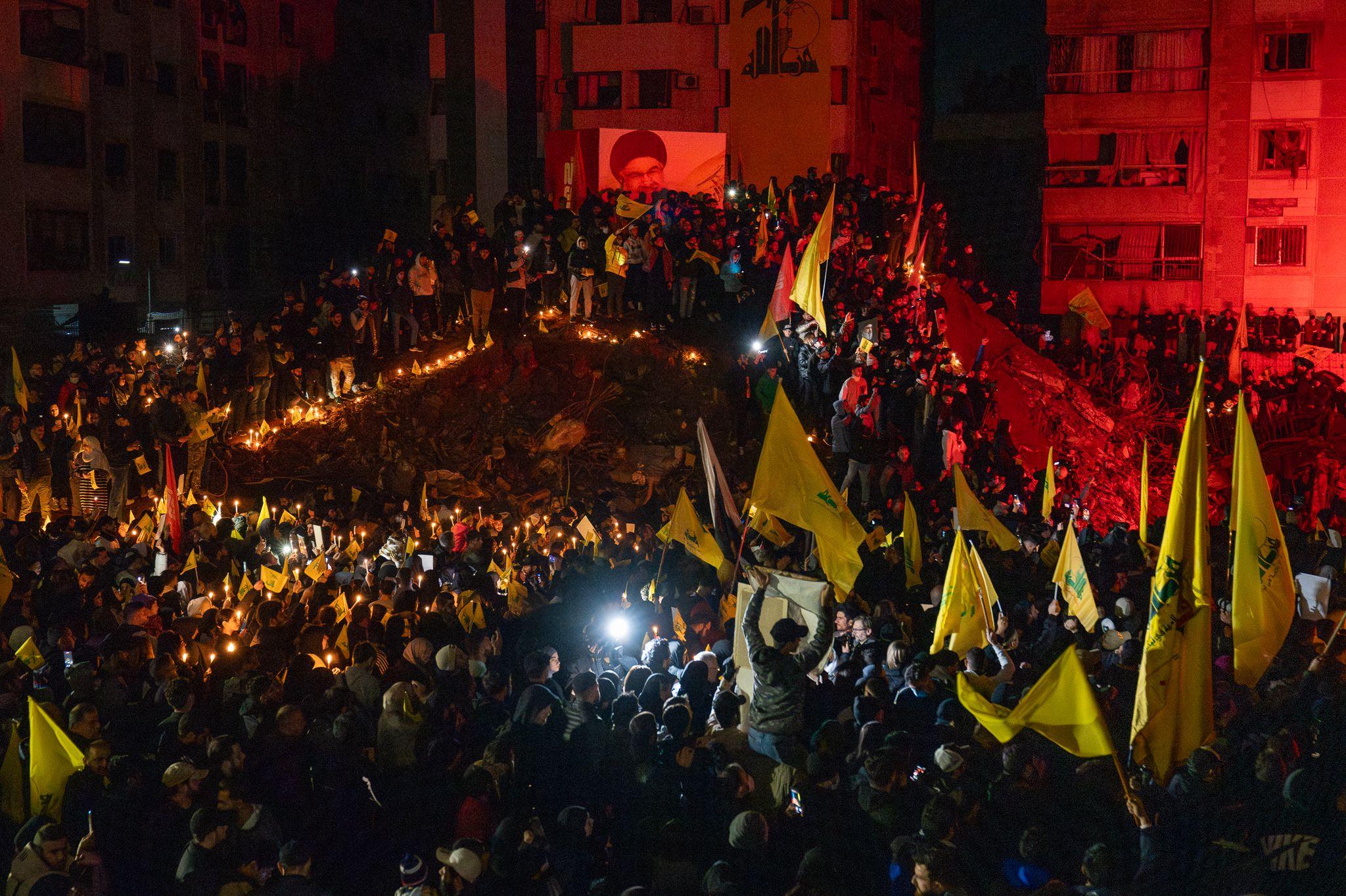 Crowds surged into the area and climbed around the crater, chanting Nasrallah's name. 