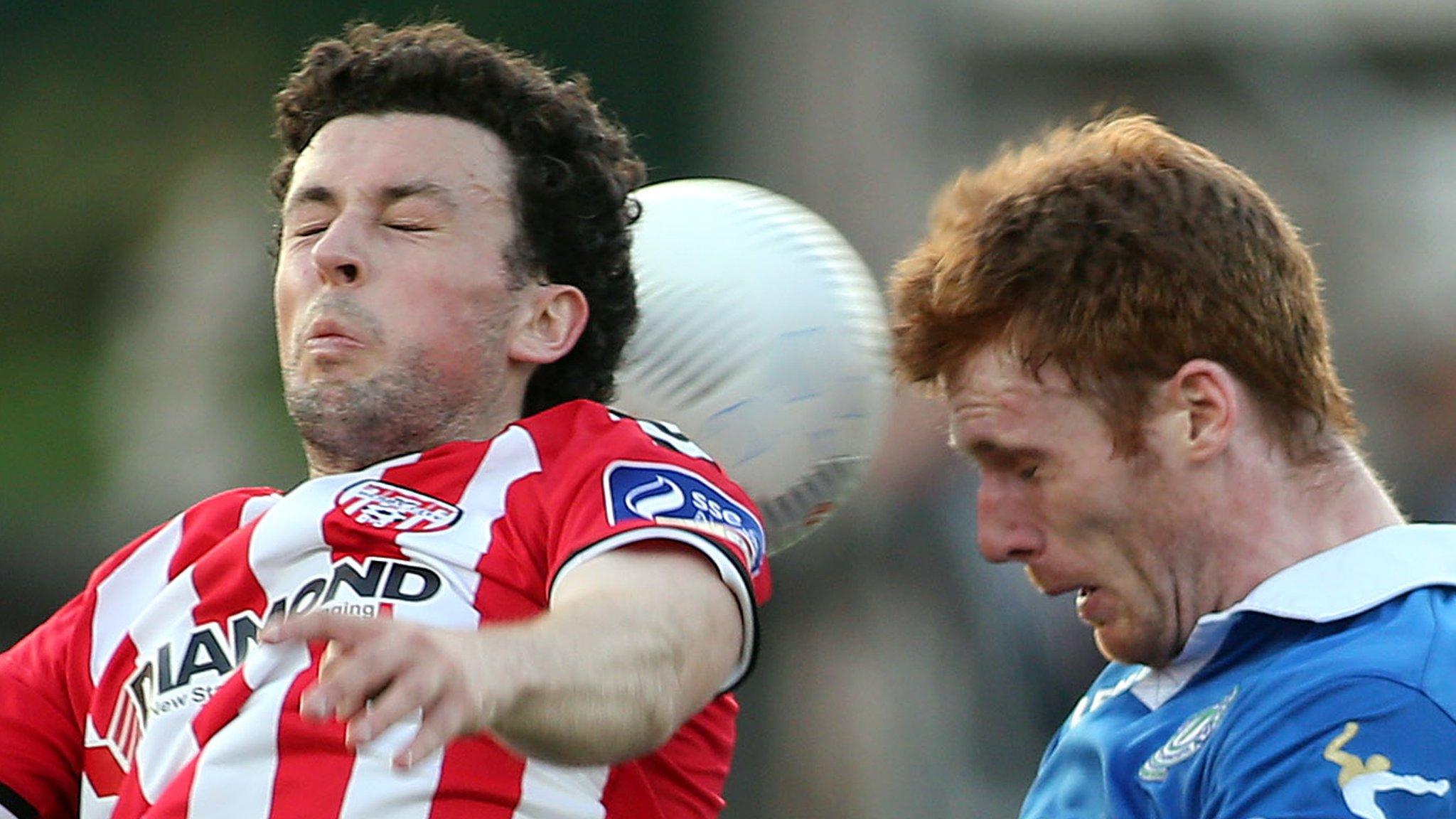 Derry City's Barry McNamee battles with Finn Harps' Sean Houston