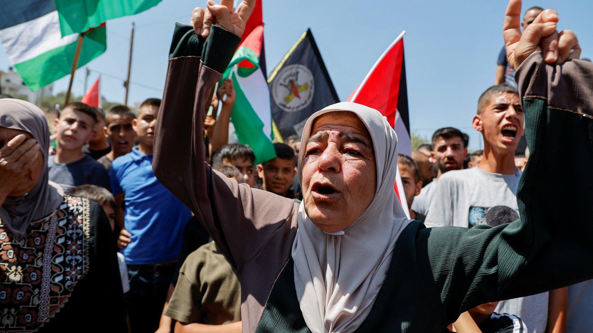 Mourners react during the funeral of Othman Abu Kharj, who was killed in an Israeli military raid in Zababdeh, in the occupied West Bank (22 August 2023)