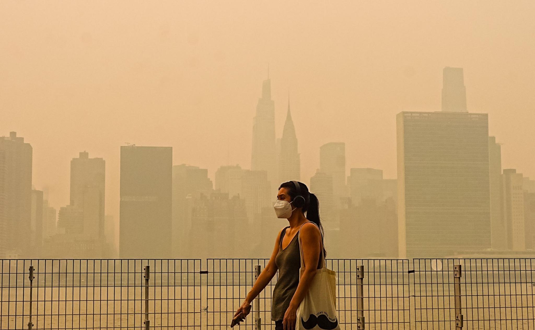 Smoke from massive wildfires in Canada engulfed the New York City skyline, reducing visibility and casting an orange haze over the New York City, United States on July 16, 2026. 