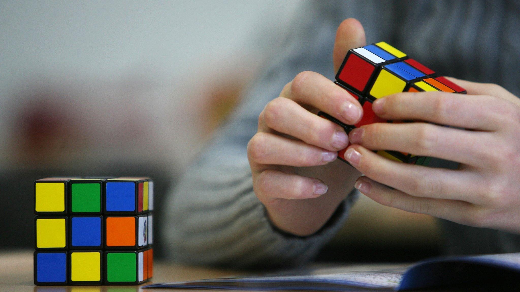 A seventh grade student of the 'Free Christian' school in Duesseldorf trys out the Rubik's Cube for the first time on November 9, 2010.