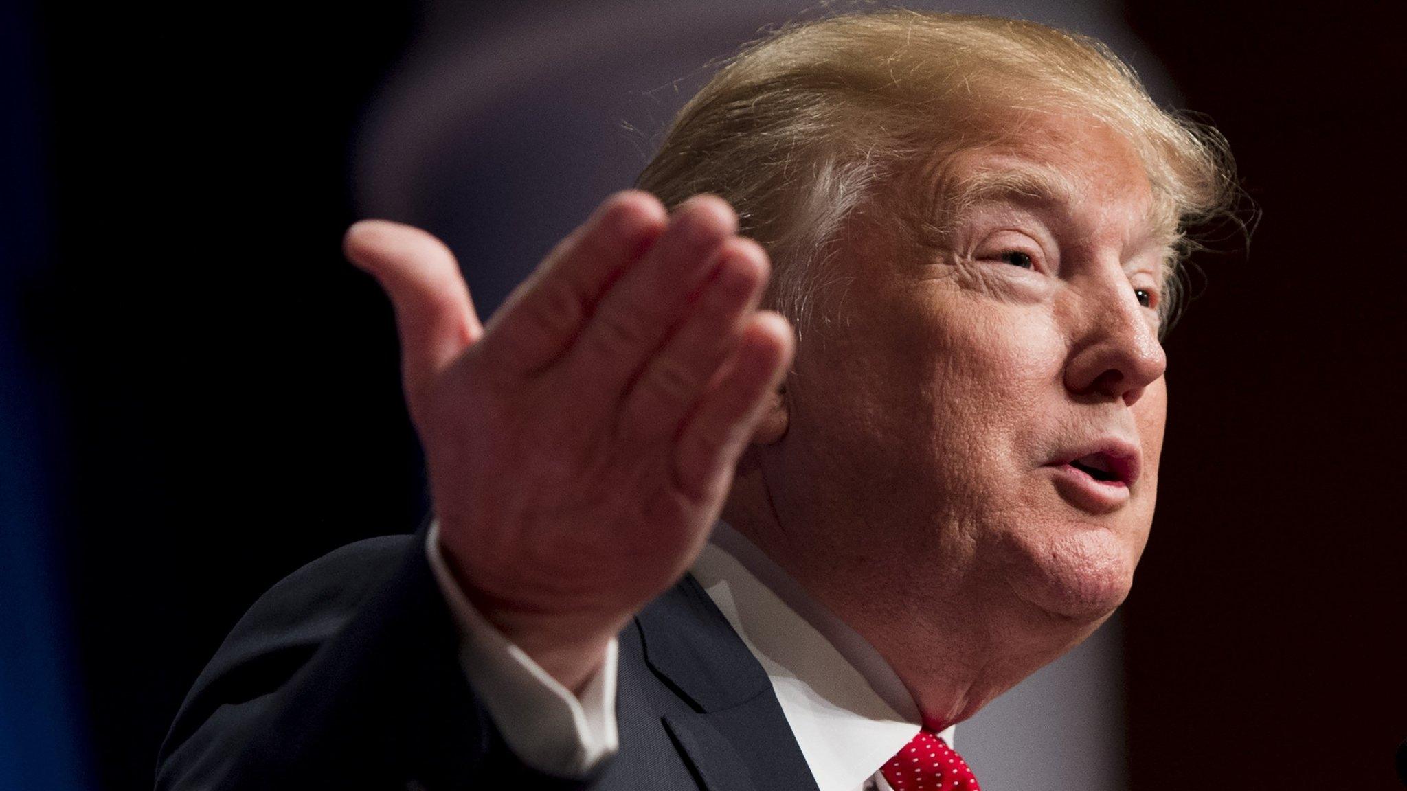 Donald Trump speaking and gesturing with his hand