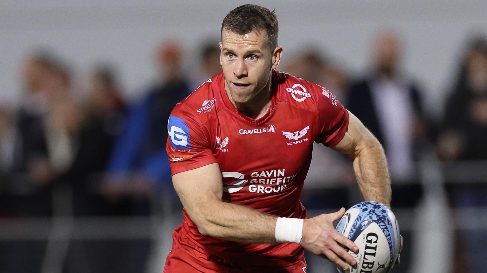 Scarlets scrum-half Gareth Davies in action against Saracens