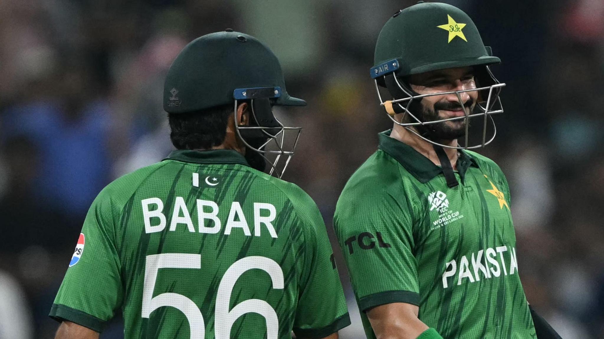 Pakistan's Sahibzada Farhan (right) and Babar Azam run between the wickets during the 2026 ICC Men's T20 Cricket World Cup group stage match between Pakistan and USA