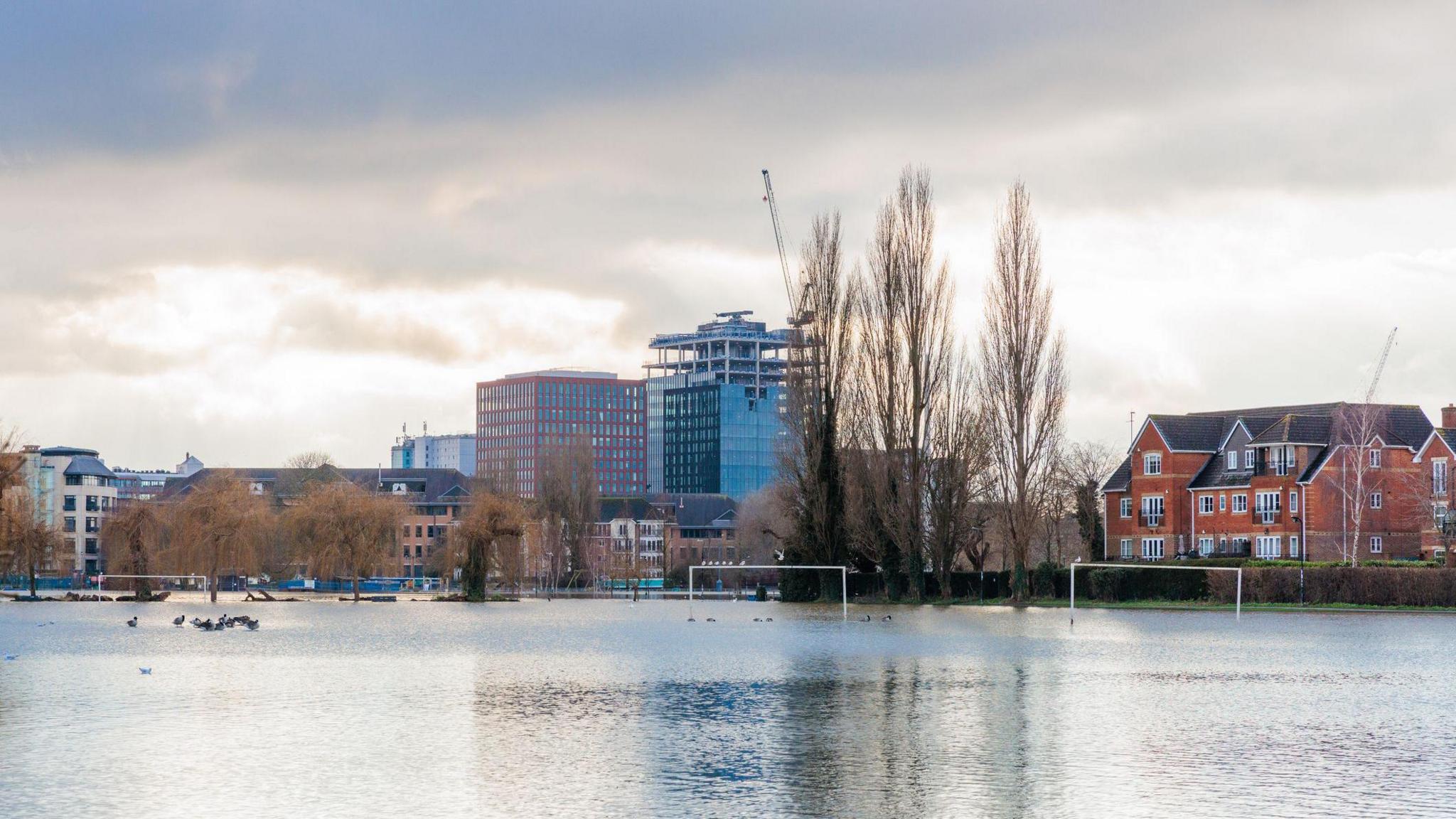 Flooding of playing fields in Caversham, with football goalposts showing that playing fields were flooded 