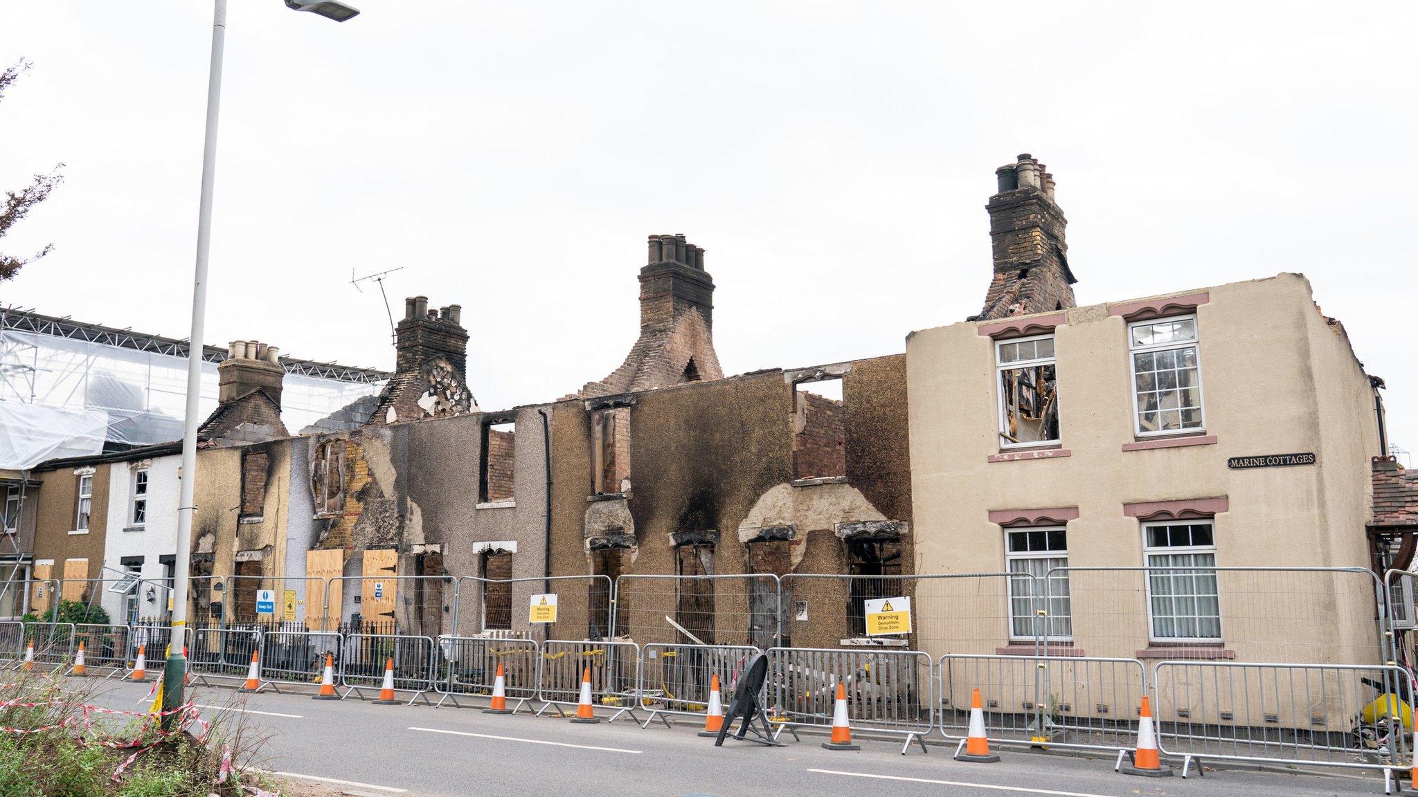 A row of fire damaged terraced houses in Wennington.