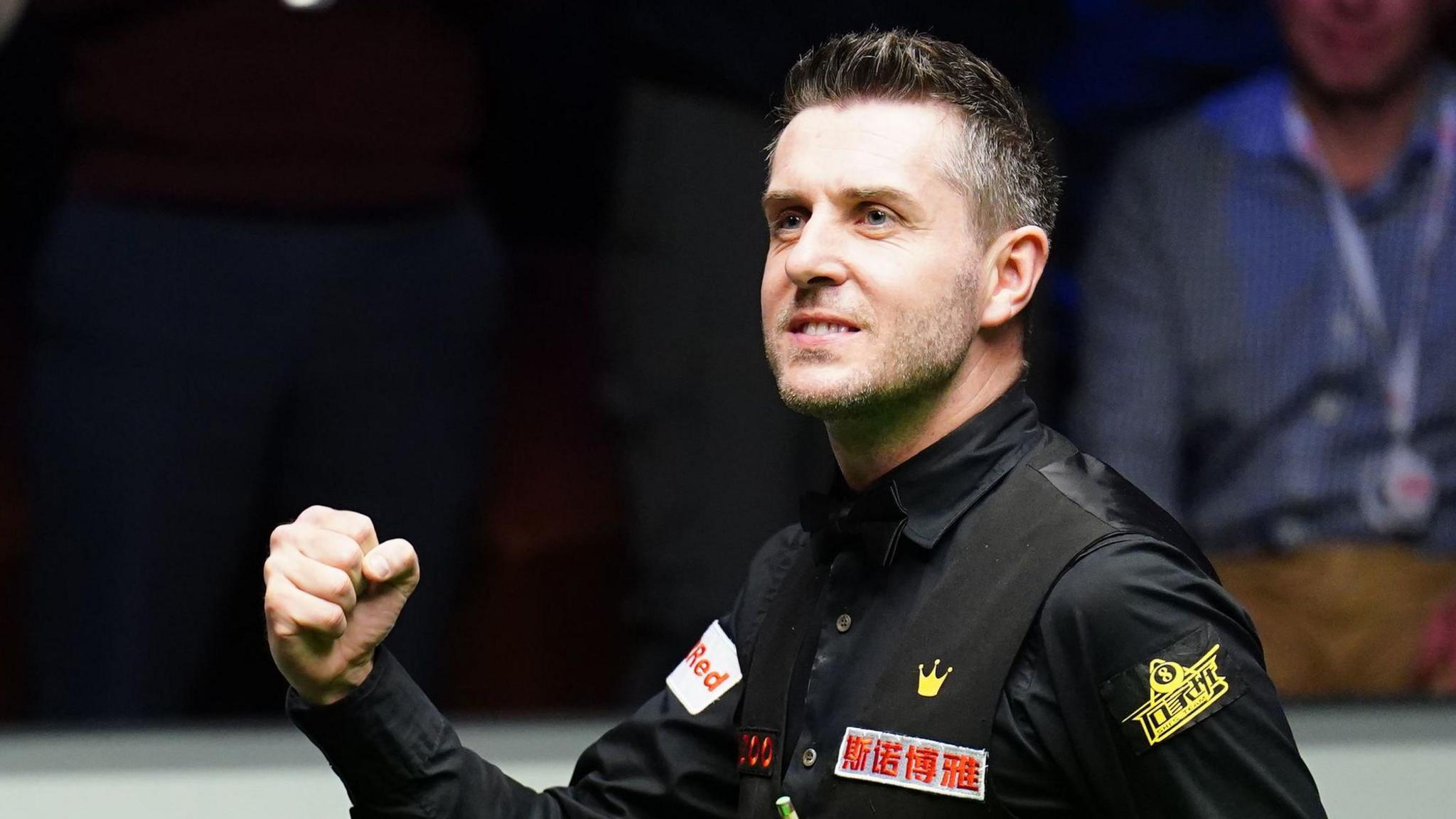 Mark Selby celebrates