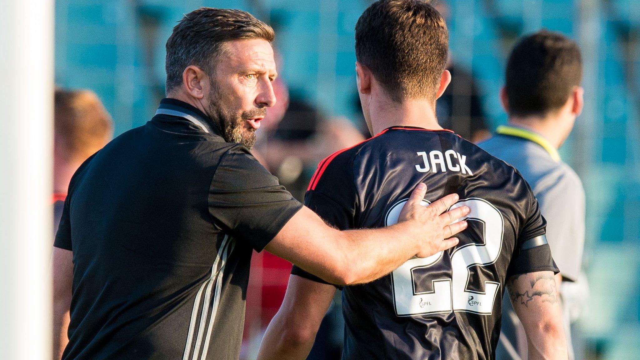 Derek McInnes consoles Aberdeen captain Ryan Jack after their defeat by Fola Esch