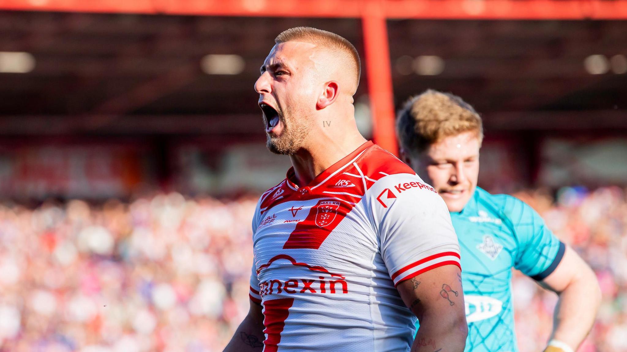 Mikey Lewis celebrates scoring his Hull KR try