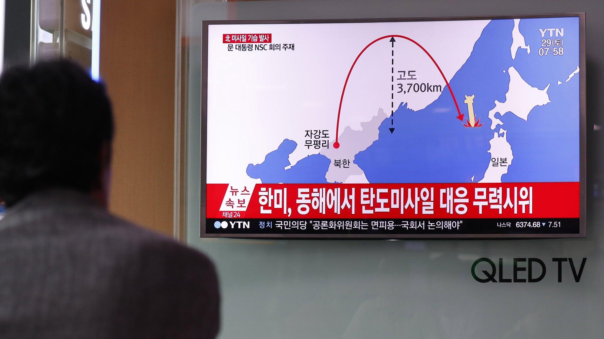 South Korean watches a TV displaying news of North Korea's latest intercontinental ballistic missile launch. Seoul, South Korea, 29 July 2017