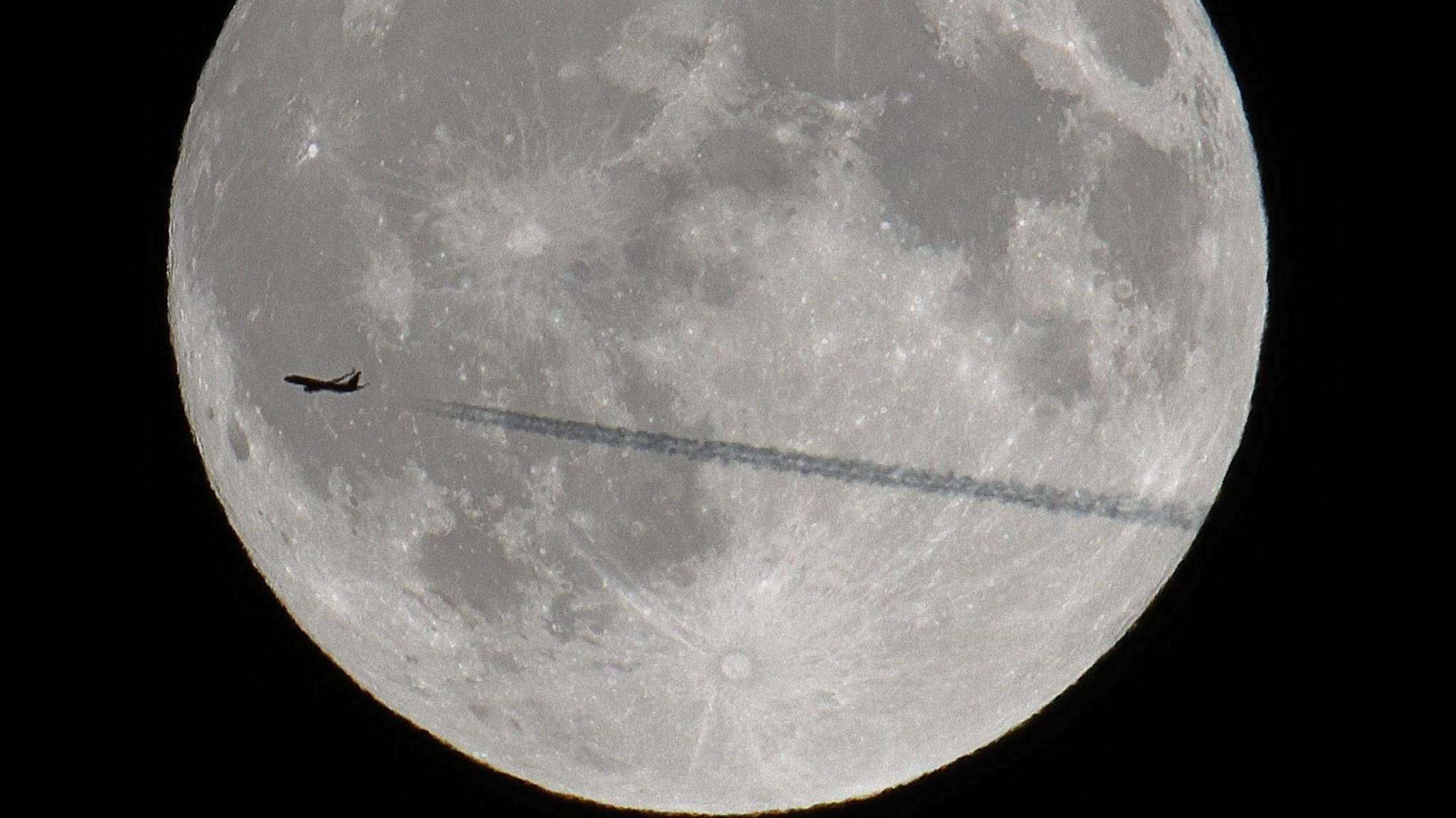 Spotted Norwegian Air Shuttle flight DY1811 transiting across the rising full moon.