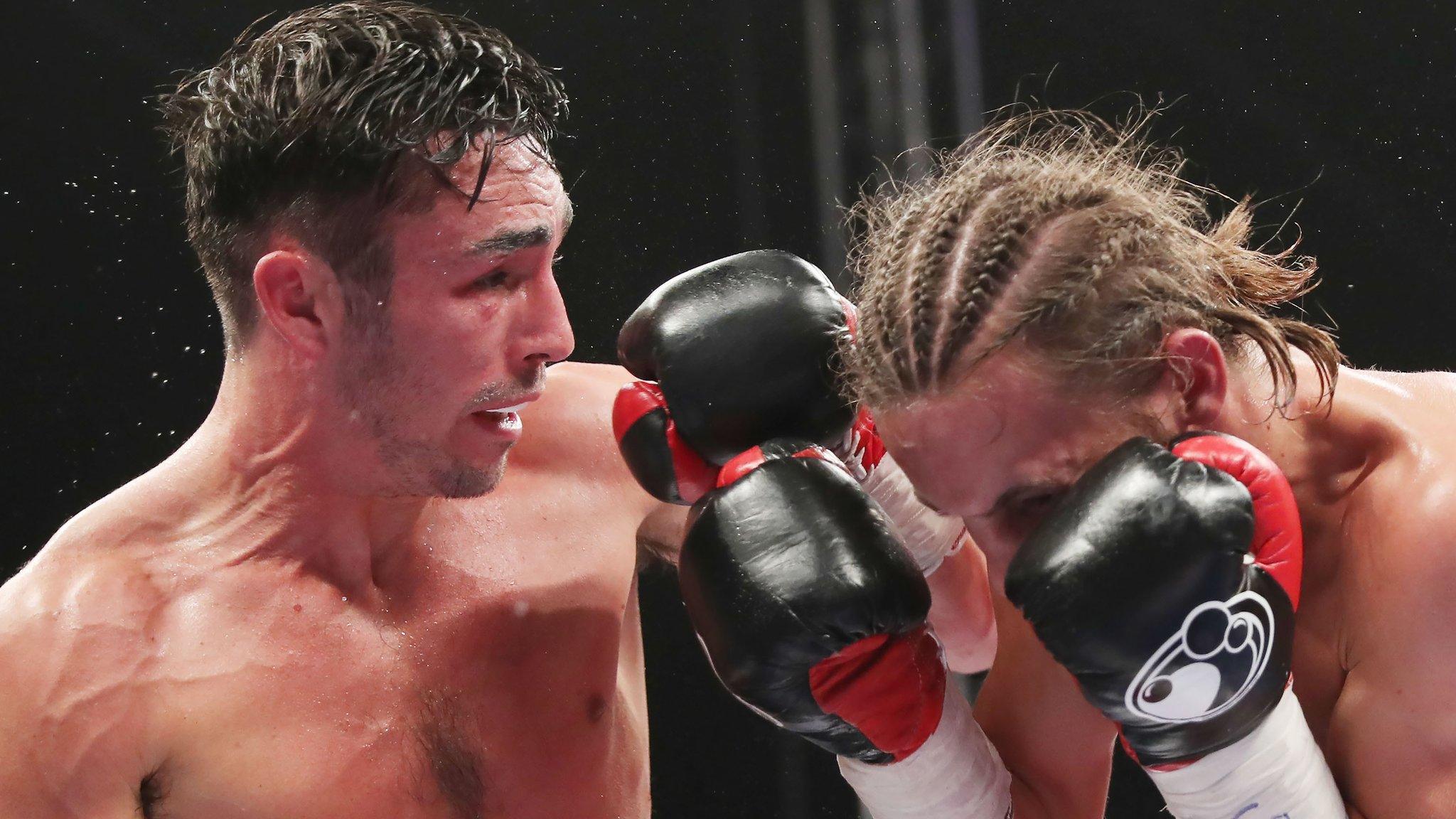 Jamie Conlan lands a punch on David Koos