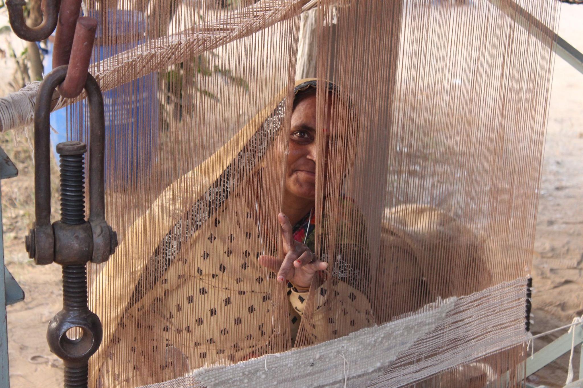 A woman peering through a sweating machine