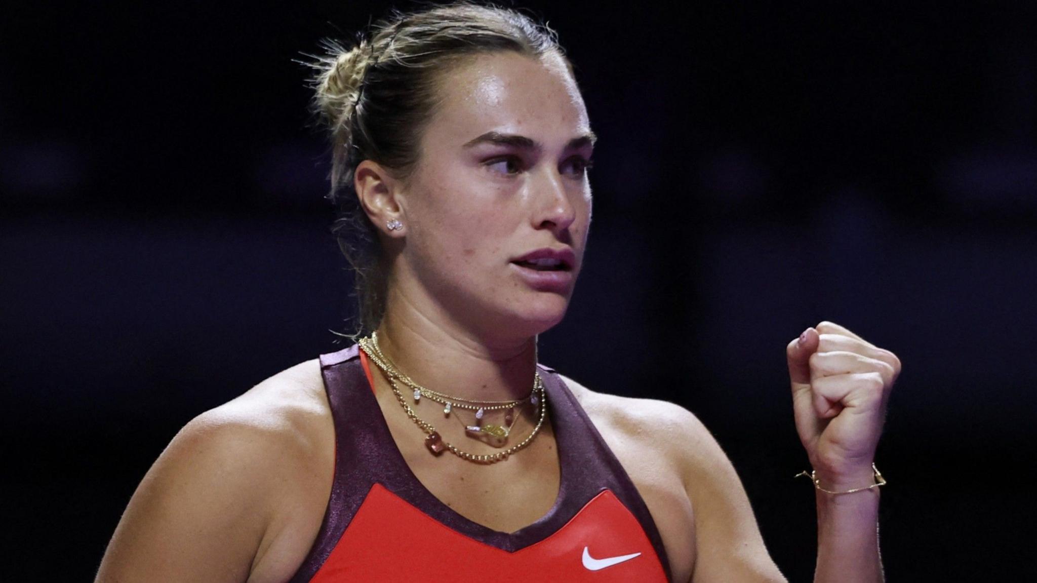 Aryna Sabalenka clenches her fist in celebration at the WTA Finals