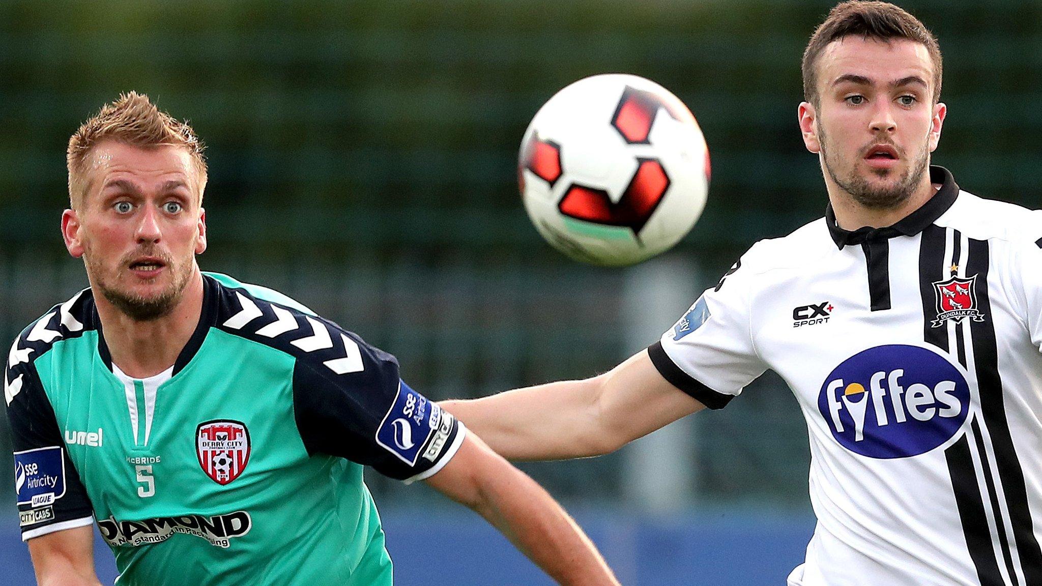 Derry midfielder Lucas Schubert battles for possession with Dundalk's Michael Duffy