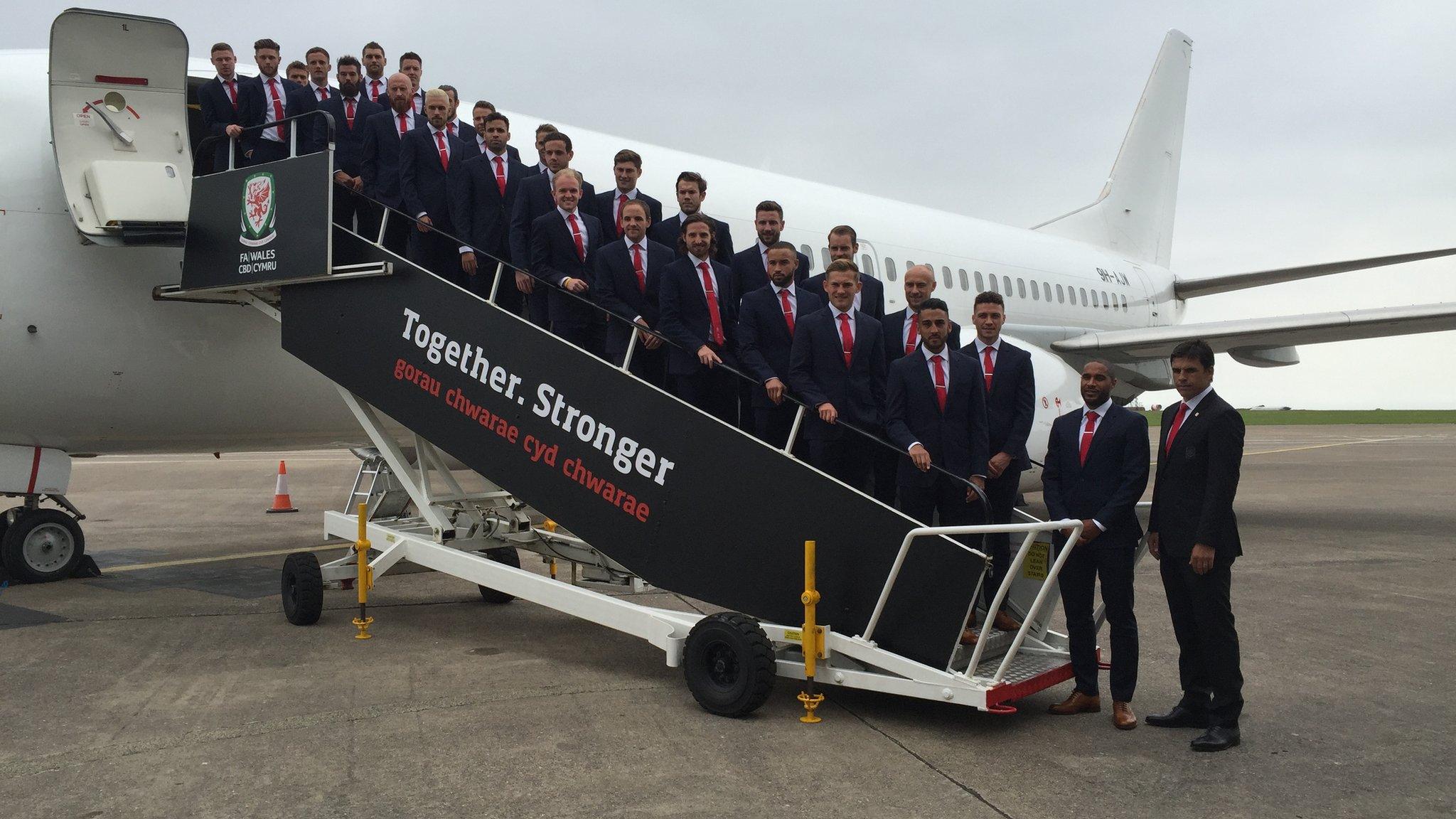 The Welsh team boards the plane