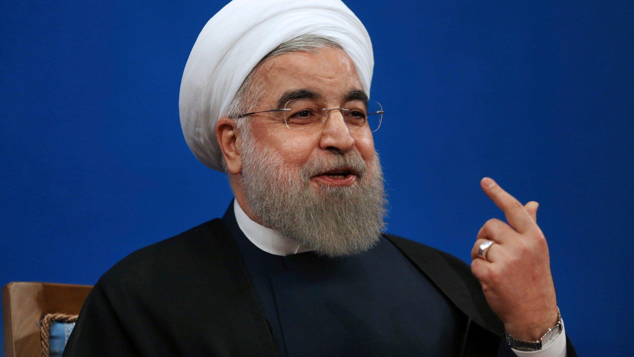 Iranian President Hassan Rouhani gestures as he speaks to reporters in Tehran (17 January 2017)