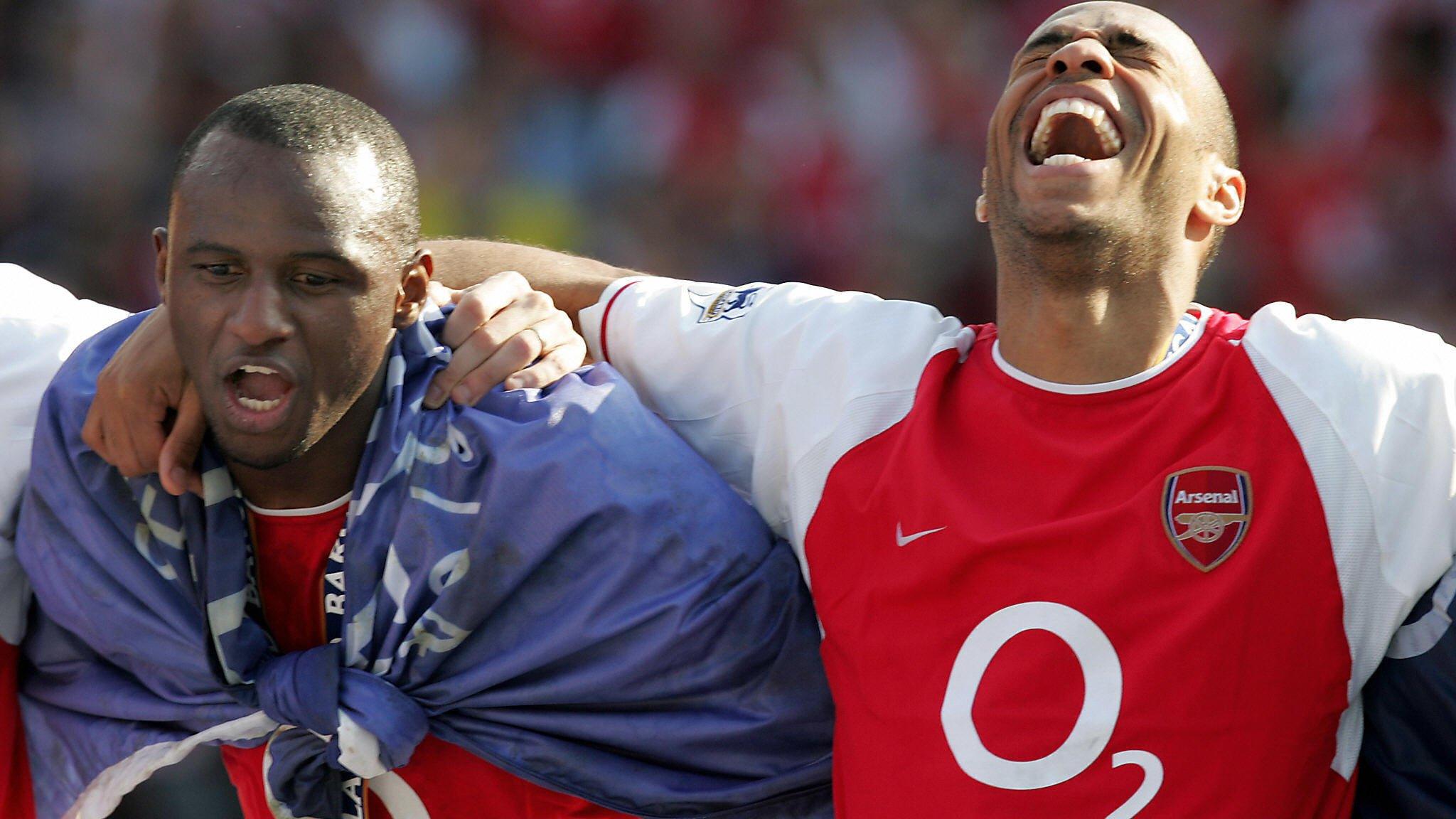 Patrick Vieira and Thierry Henry celebrate Arsenal's 2004 Premier League title