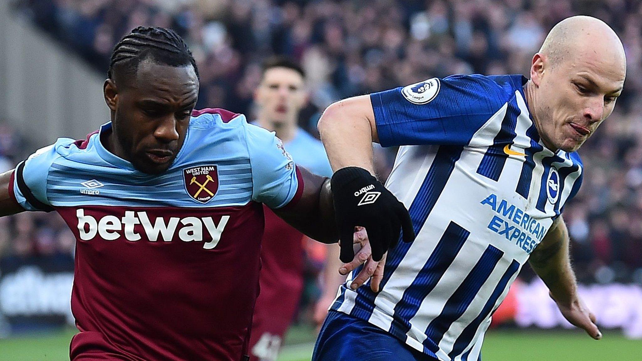 West Ham's Michail Antonio (left) and Brighton's Aaron Mooy (right) compete for the ball during a Premier League match