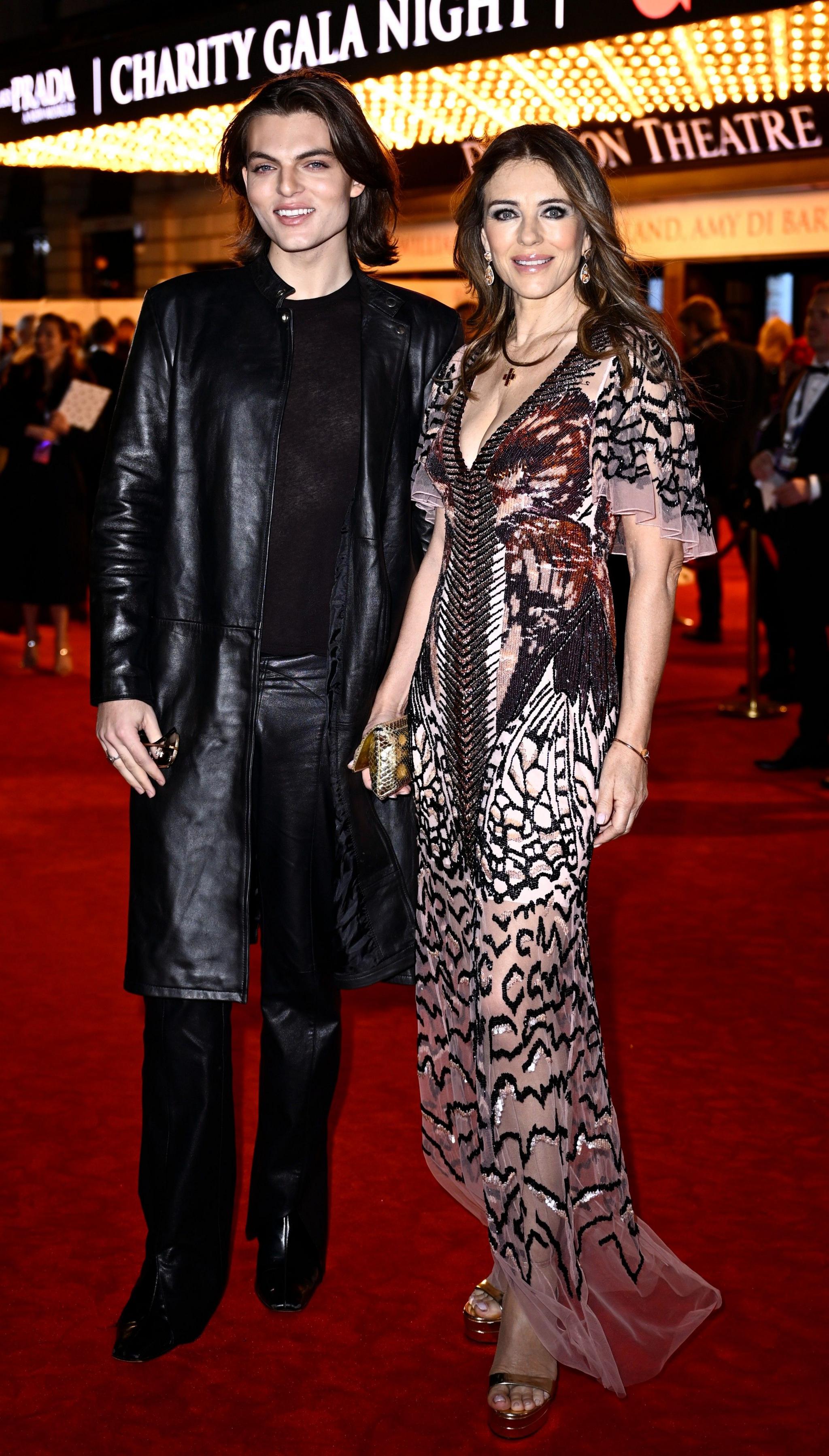 Elizabeth Hurley (right) and son Damian Hurley (left) on Dominion Theatre red carpet for The Devil Wears Prada The Musical