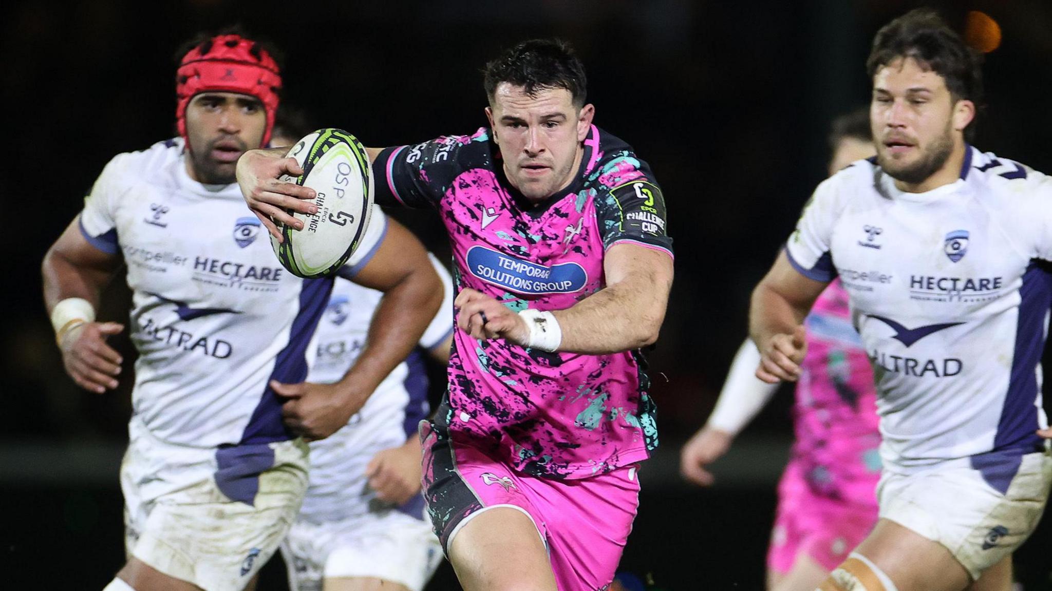 Owen Watkin carries the ball hard for Ospreys against Montpellier