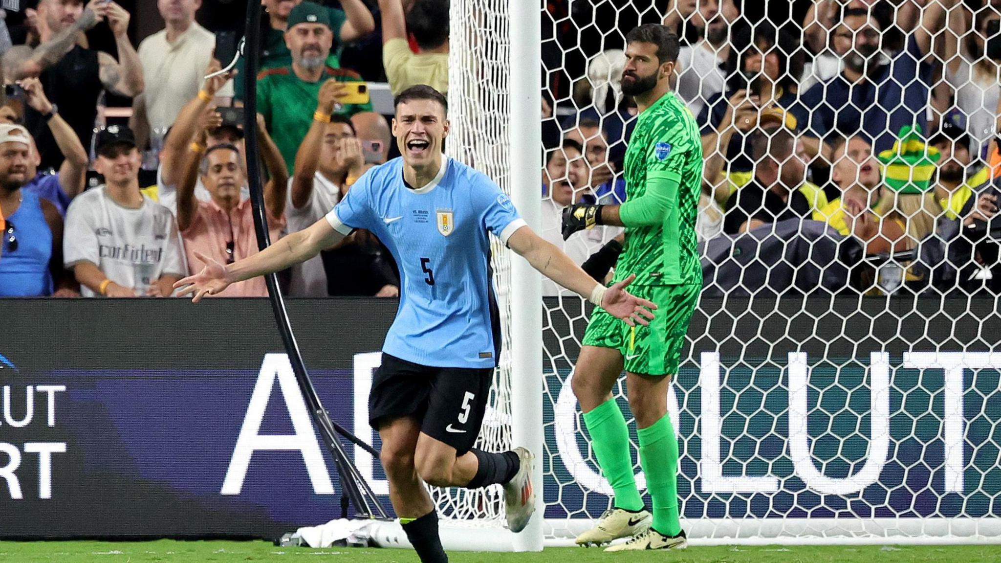 Manuel Ugarte celebrates after scoring the decisive penalty for Uruguay