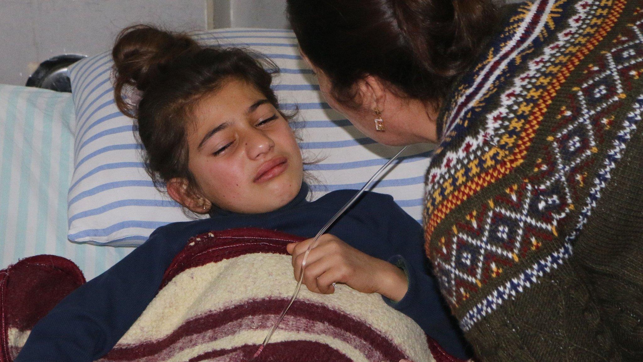 A mother comforts her wounded daughter at a hospital in the Kurdish enclave of Afrin, Syria (20 February 2018)