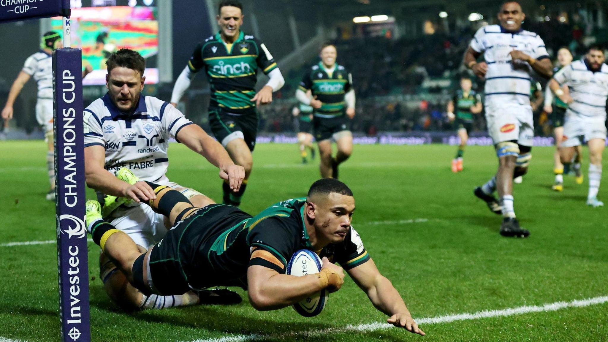 Northampton back row Juarno Augustus dives in at the corner to score a try