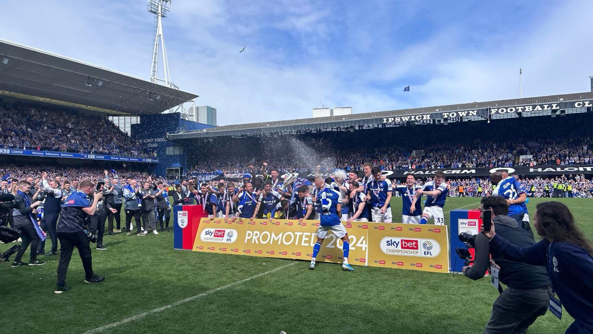 Ipswich Town players celebrate following the promotion to the Premier League