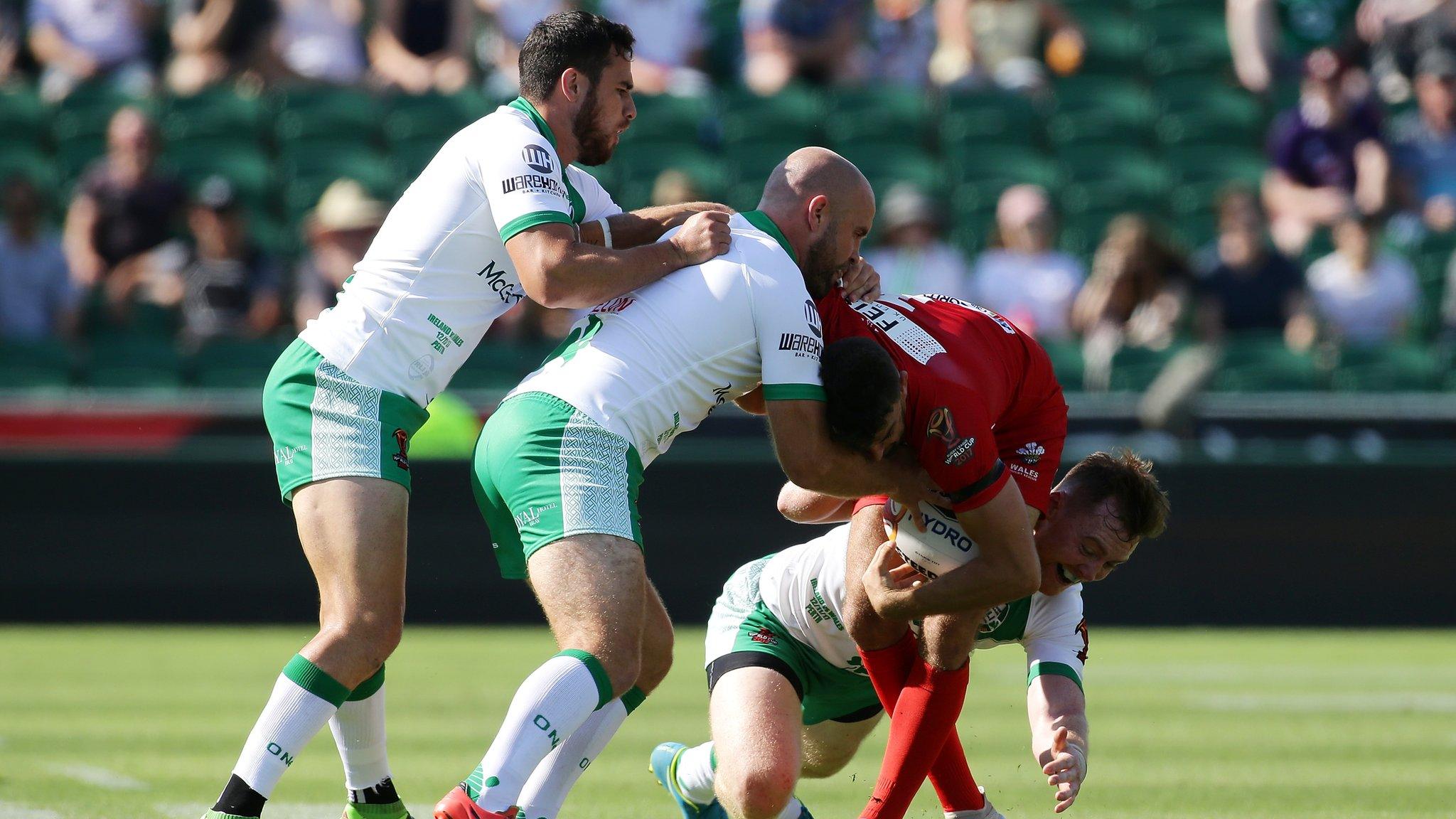 Wales' Elliot Kear tackled