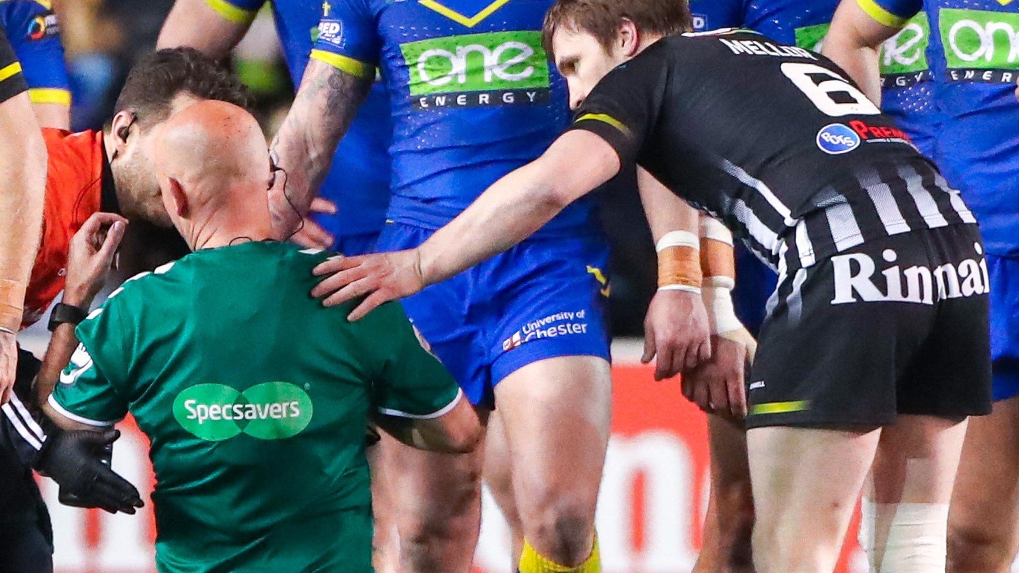 Referee Phil Bentham receives treatment after his collision with Chris Houston