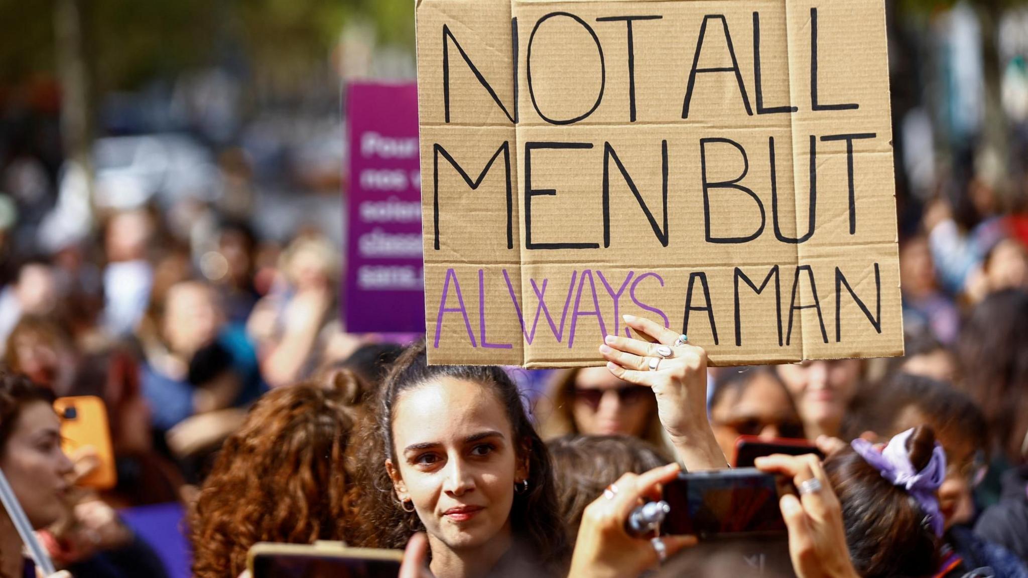 A woman holds a placard during a protest in support of Gisèle Pelicot