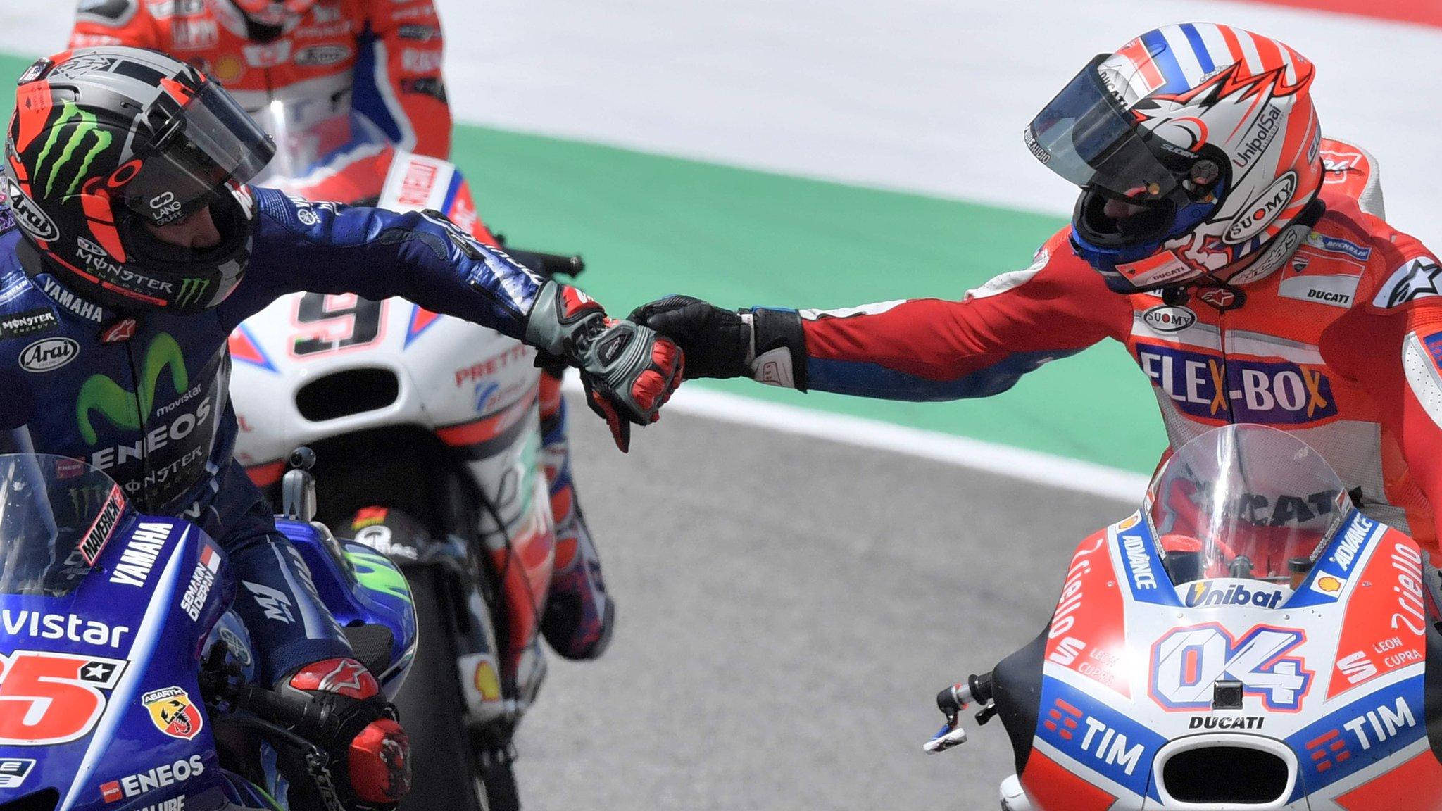 Ducati's Andrea Dovizioso (right) celebrates with Movistar Yamaha's Spanish rider Maverick Vinales (left)