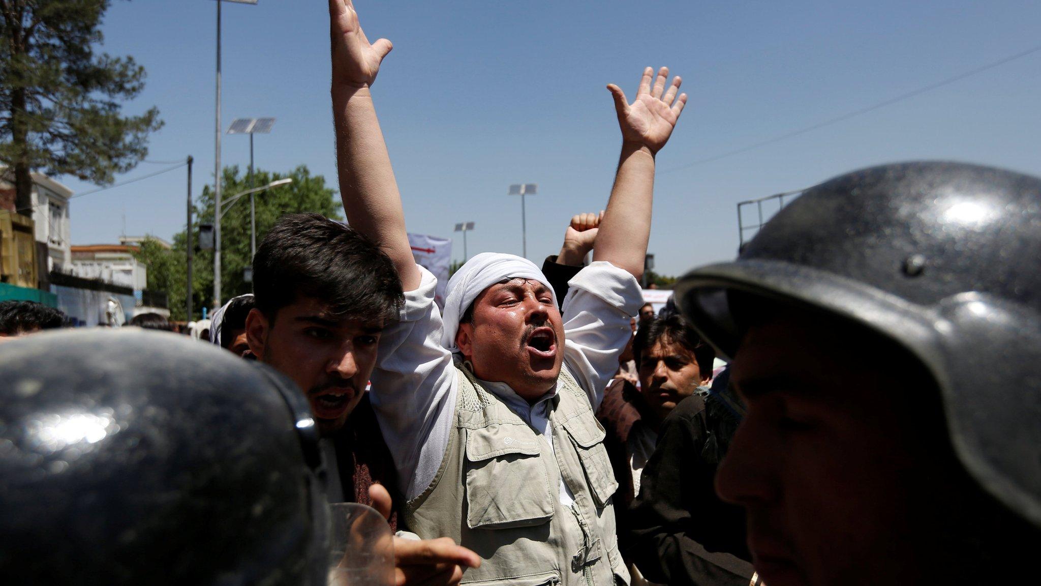 Afghan policemen clash with demonstrators during a protest in Kabul, Afghanistan 2 June 2017