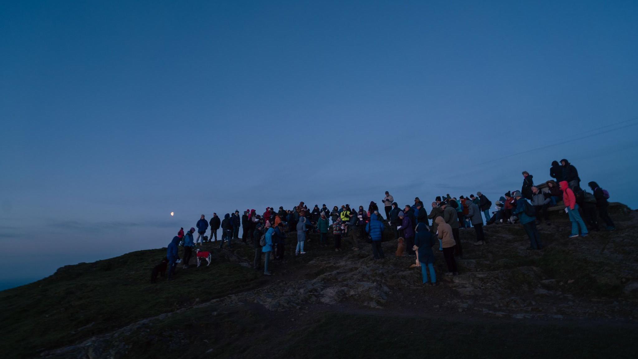 Worshippers at sunrise on Worcestershire Beacon