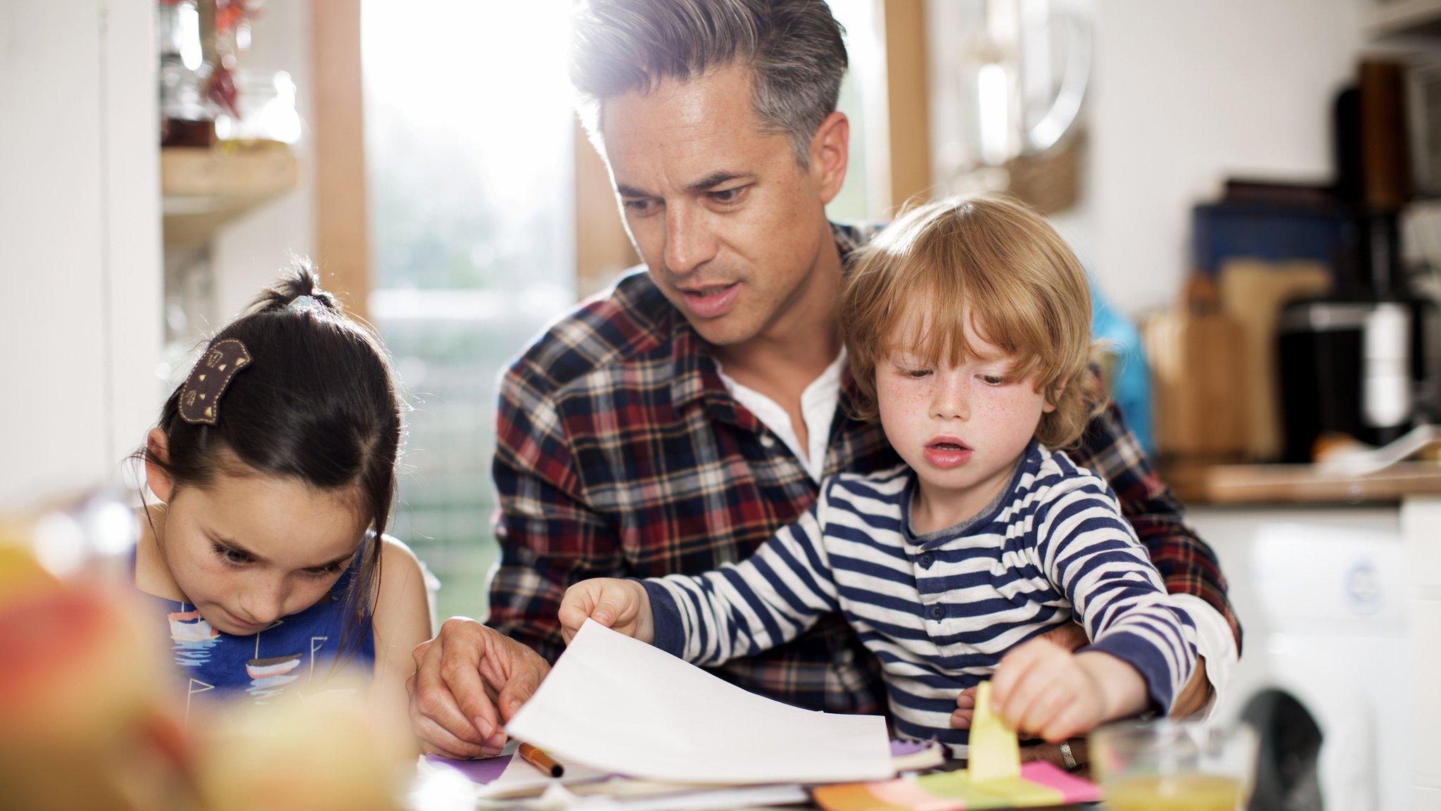 A parent with two children