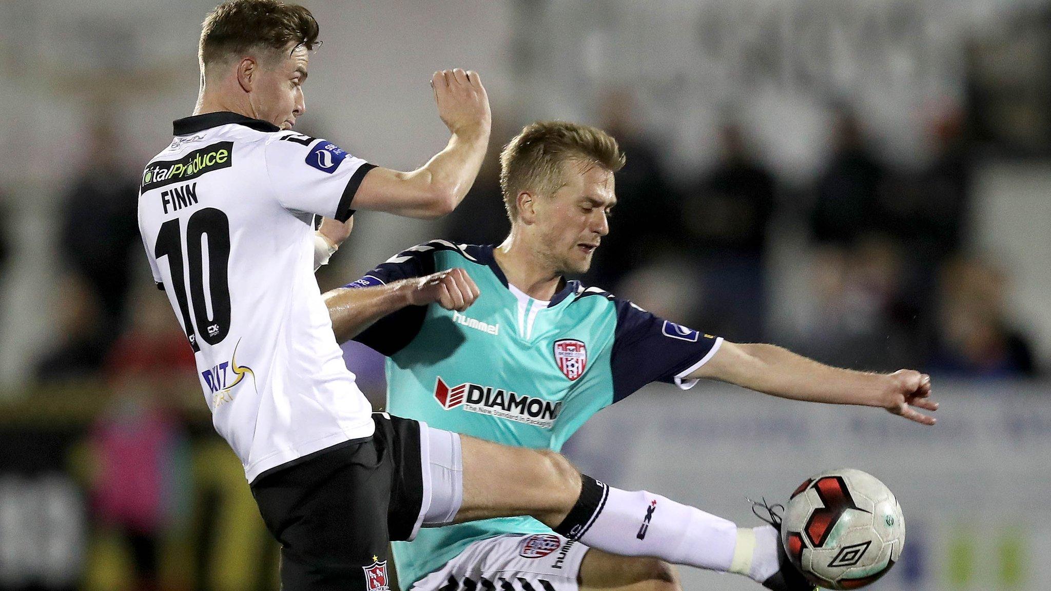 Dundalk's Ronan Finn challenges Derry midfielder Lukas Schubert