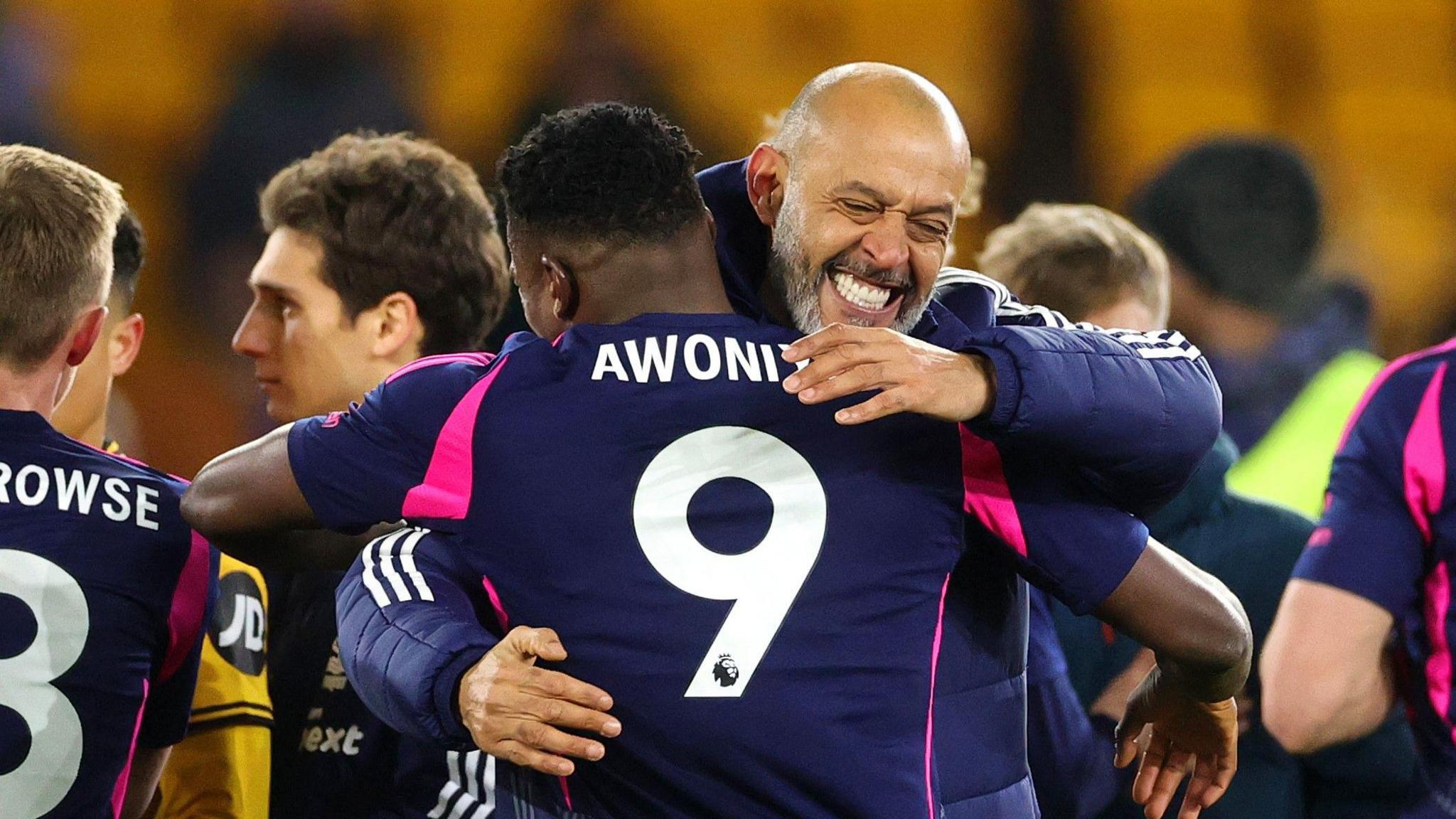 Nuno Espirito Santo celebrates Nottingham Forest's win with Taiwo Awoniyi. 