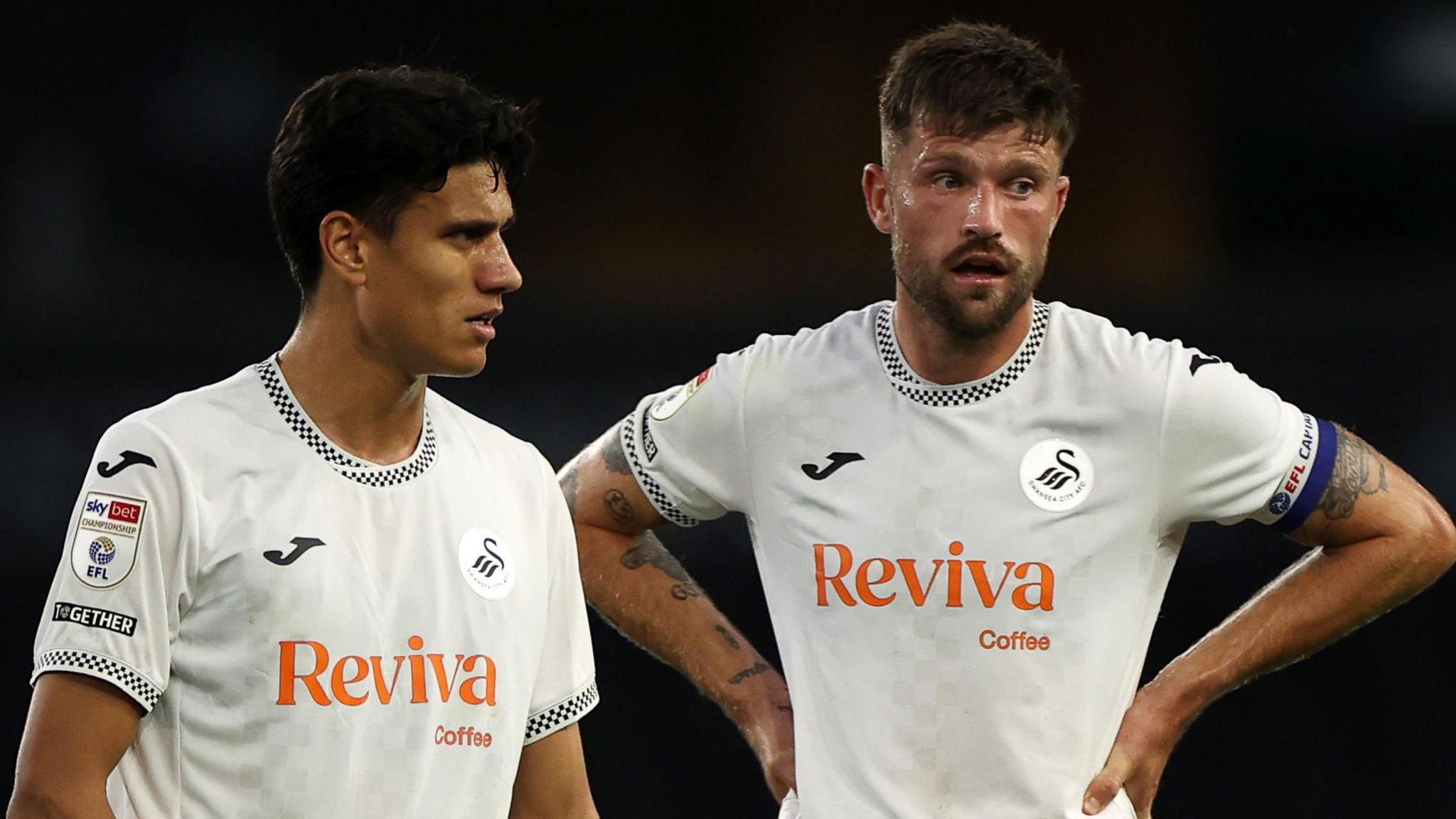 Marko Stamenic on the pitch alongside Cameron Burgess
