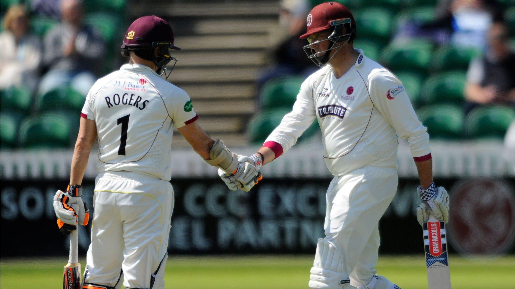 Marcus Trescothick celebrates his half century against Yorkshire at Taunton with Somerset captain Chris Rogers