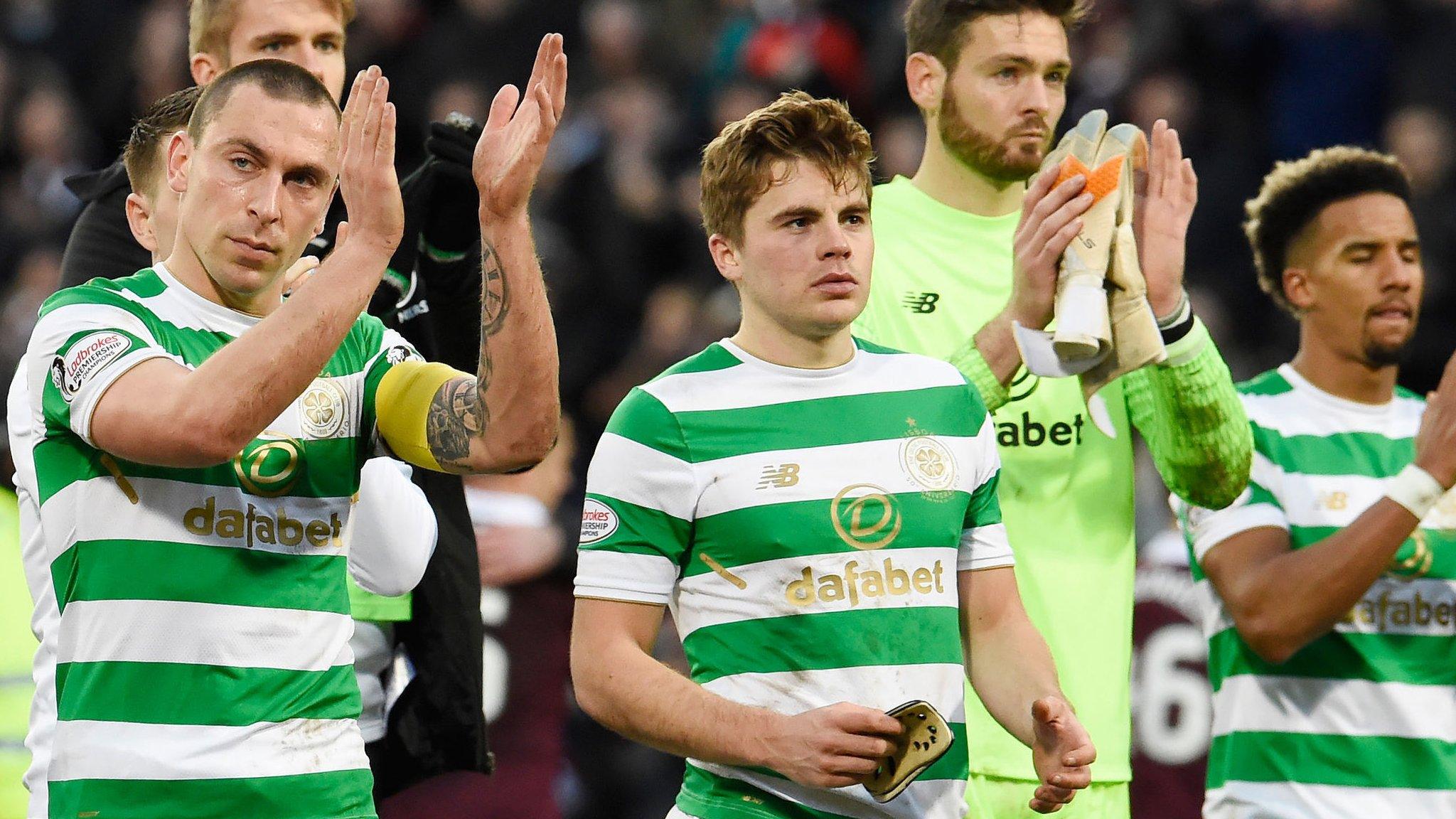 Celtic players applaud the travelling fans after losing 4-0 at Hearts