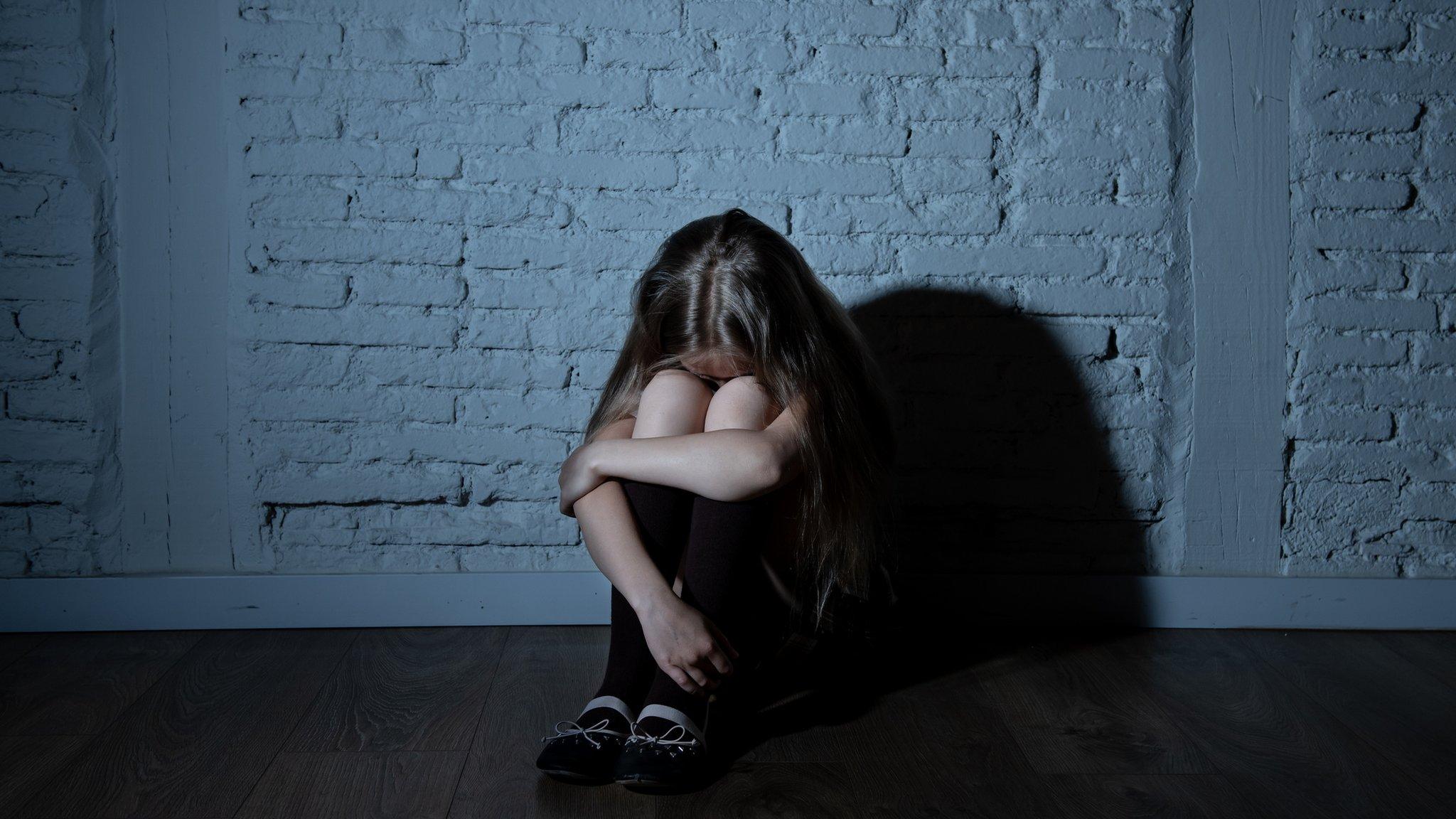 A stock image of a child in seclusion